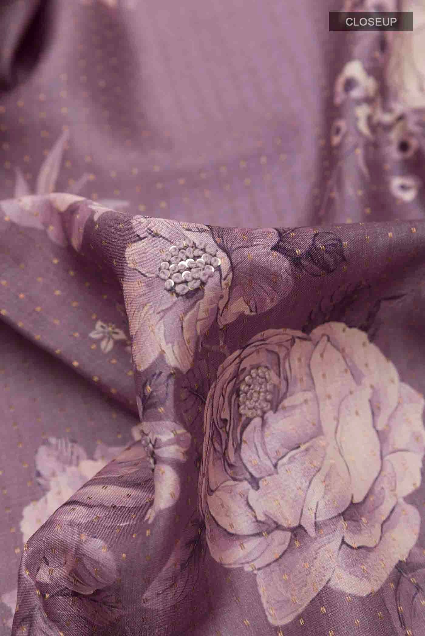 Close up of Lilac Tussar Saree with Printed design on the body and Thread Border displaying folds