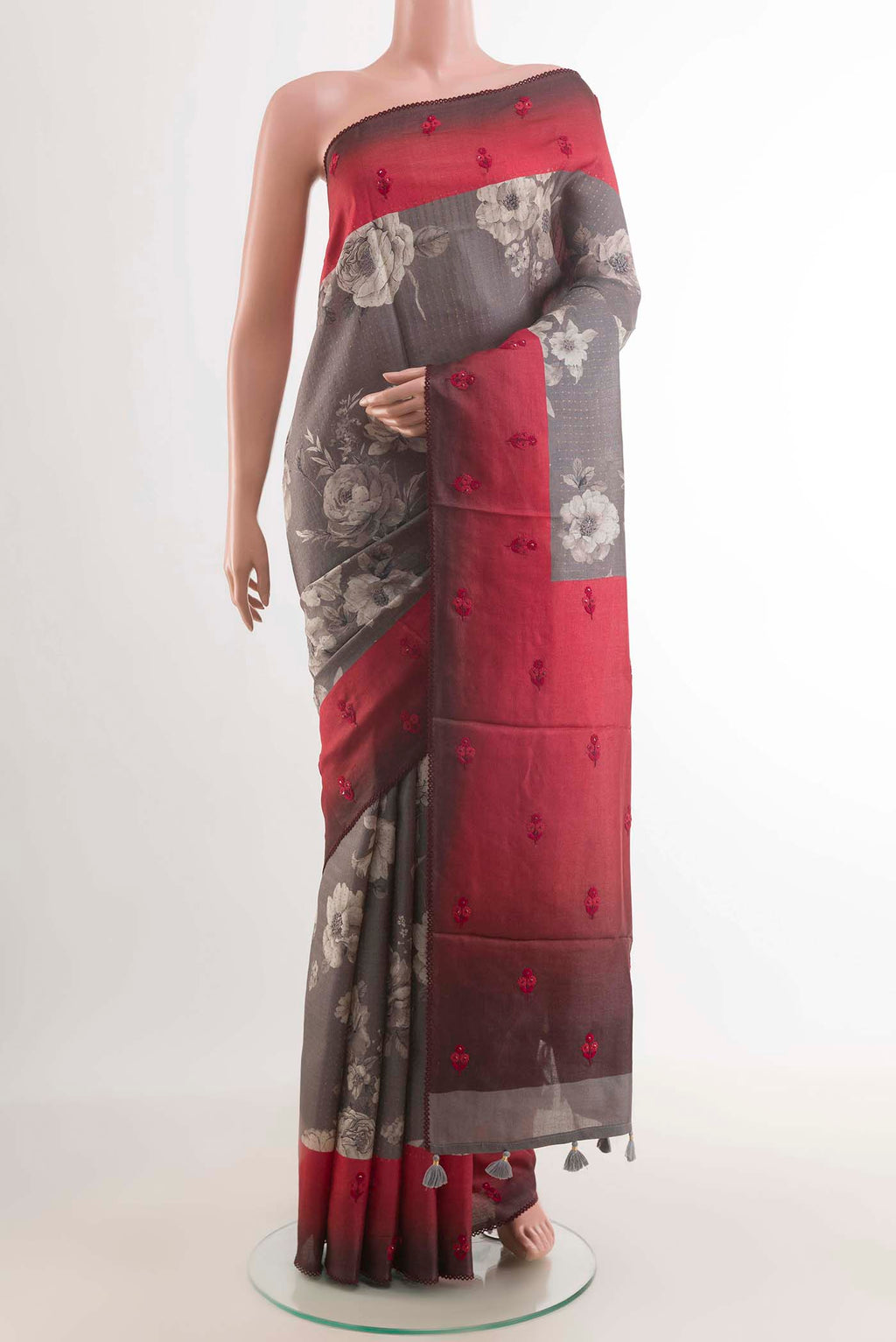 Grey Tussar Saree with Printed design on the body and Thread Border displayed on a mannequin