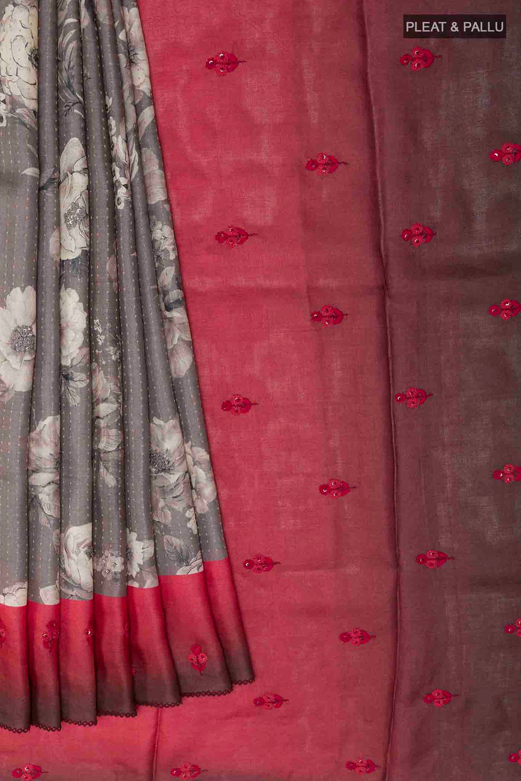 Pleats and pallu of Grey Tussar Saree with Printed design on the body and Thread Border