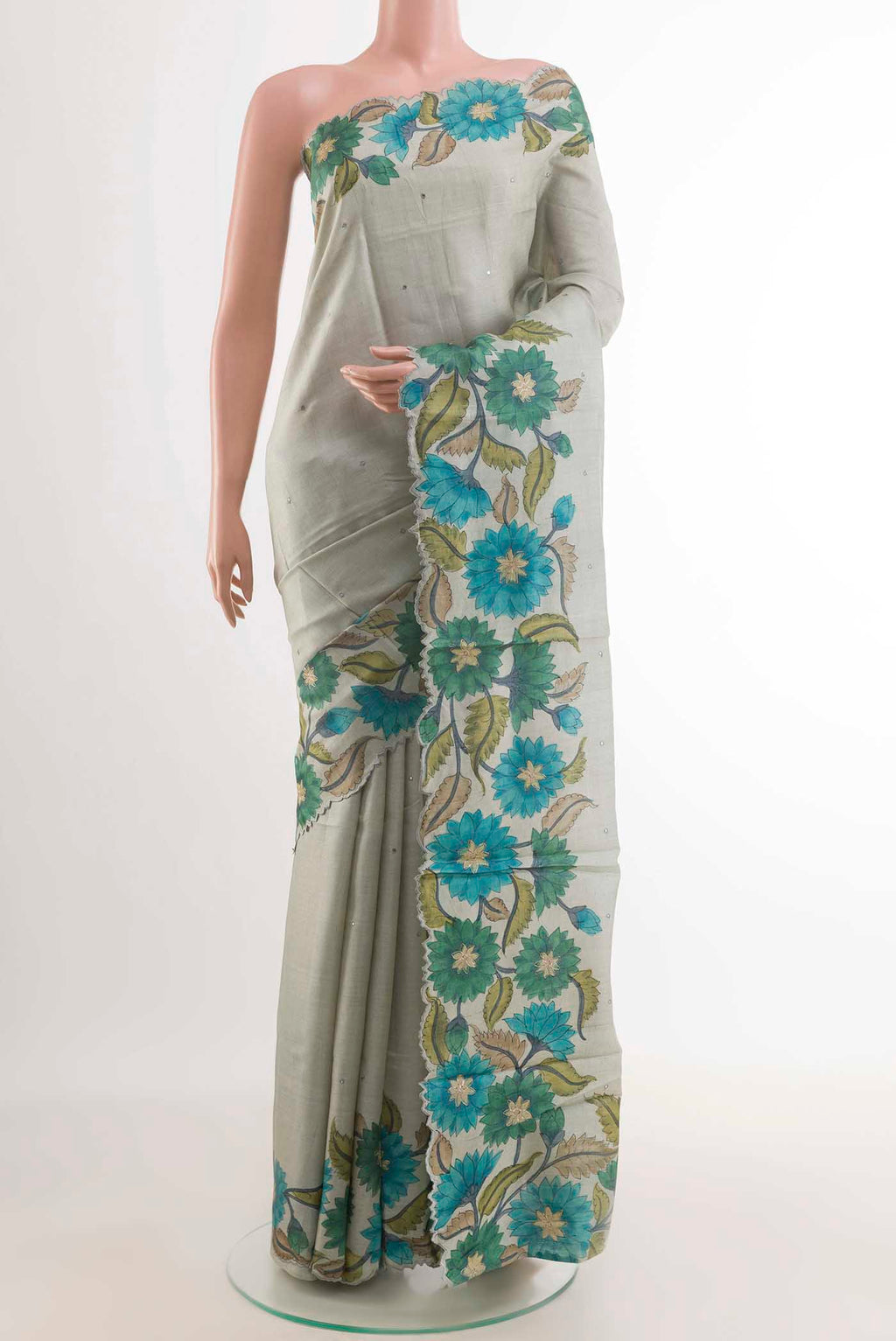 Grey Tussar Saree with Thread Butta on the body and Printed Border displayed on a mannequin
