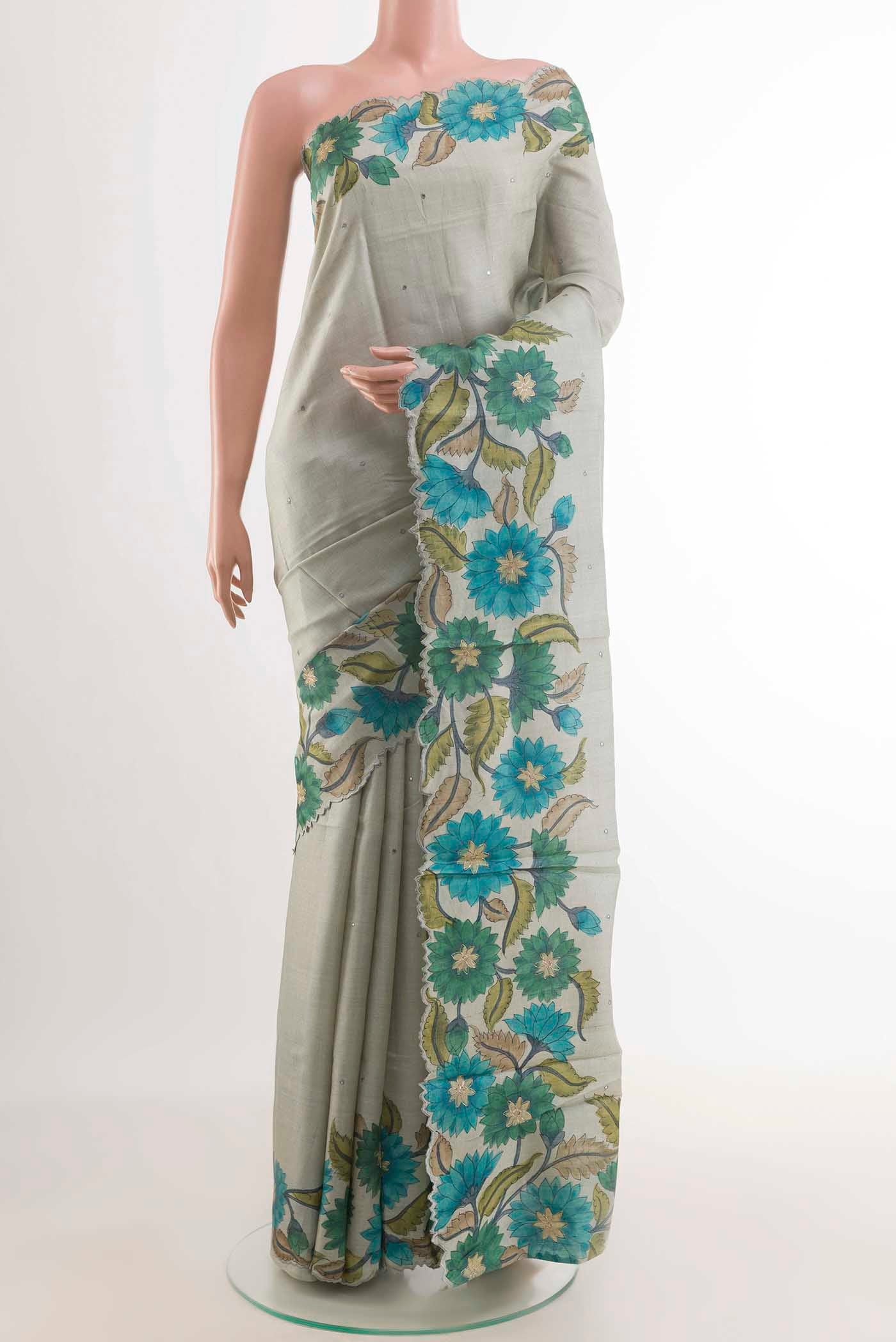 Grey Tussar Saree with Thread Butta on the body and Printed Border displayed on a mannequin