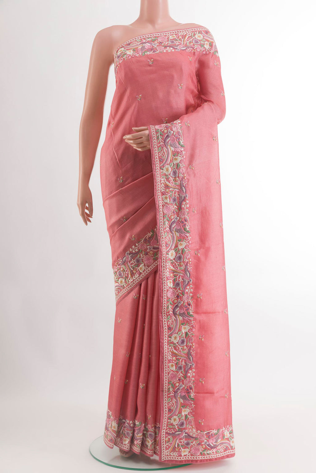 Coral Tussar Silk Saree with Embroidery on the body and Embroidery Border.  displayed on a mannequin