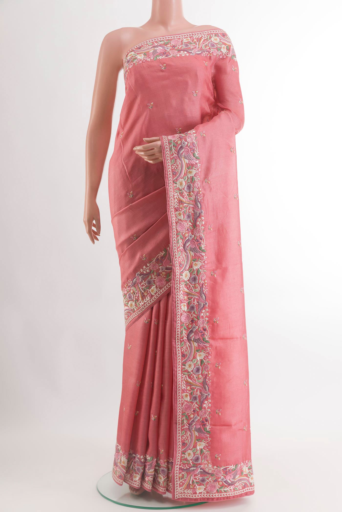 Coral Tussar Silk Saree with Embroidery on the body and Embroidery Border.  displayed on a mannequin