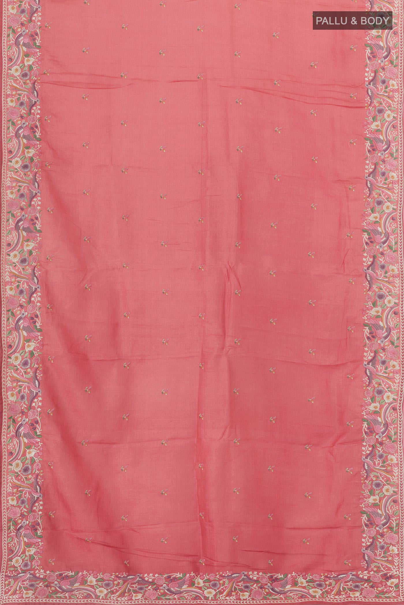 Flat view of Coral Tussar Silk Saree with Embroidery on the body and Embroidery Border. 