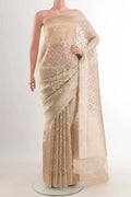 Beige Organza Silk Saree with Zari Brocade on the body and Zari Border displayed on a mannequin