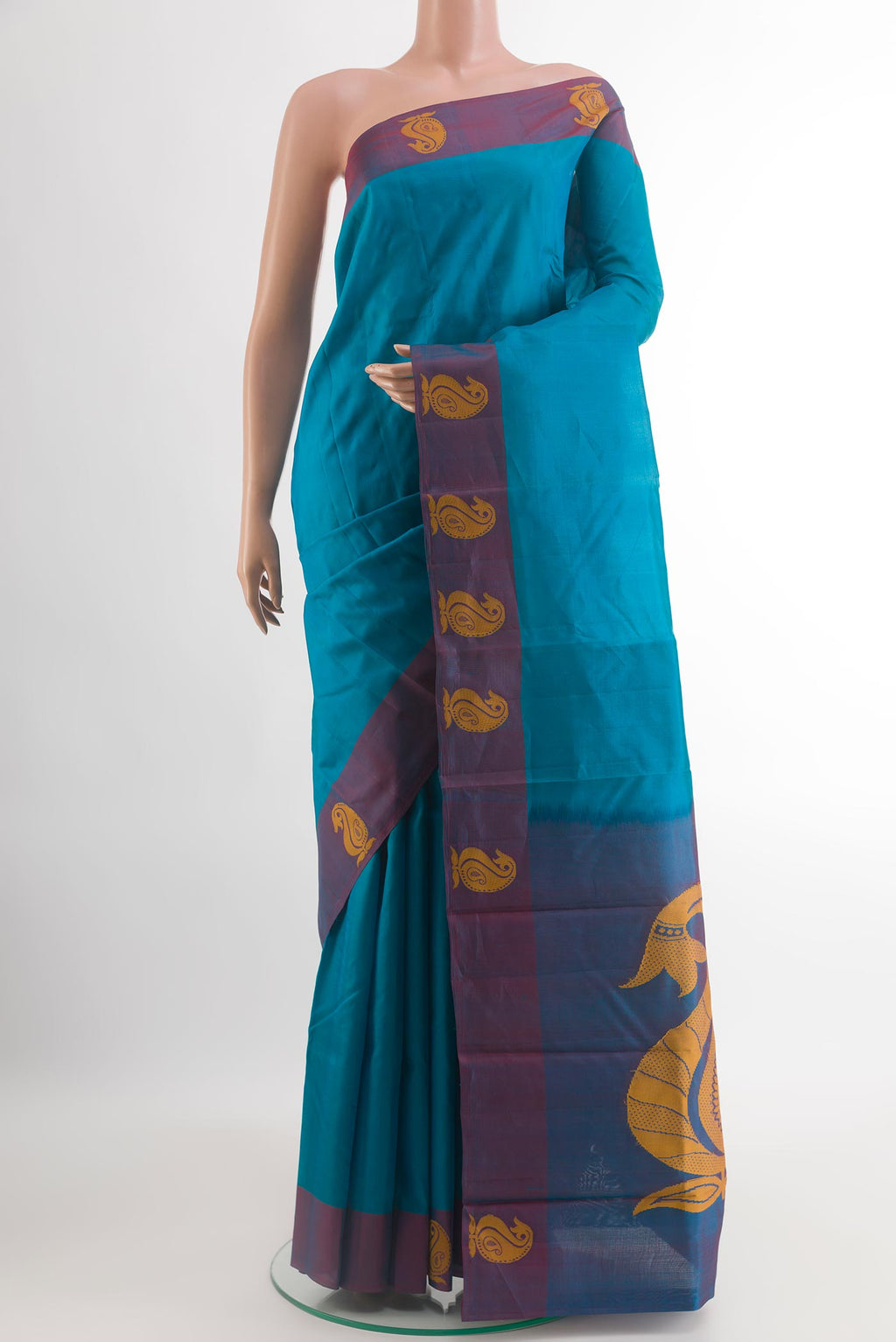 Blue Kanjivaram Silk Saree with Plain Body and Thread Border.  displayed on a mannequin