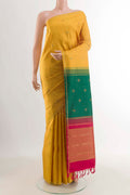 Mustard Kanchipuram Silk Saree with Zari Butta on the body and Zari Border displayed on a mannequin