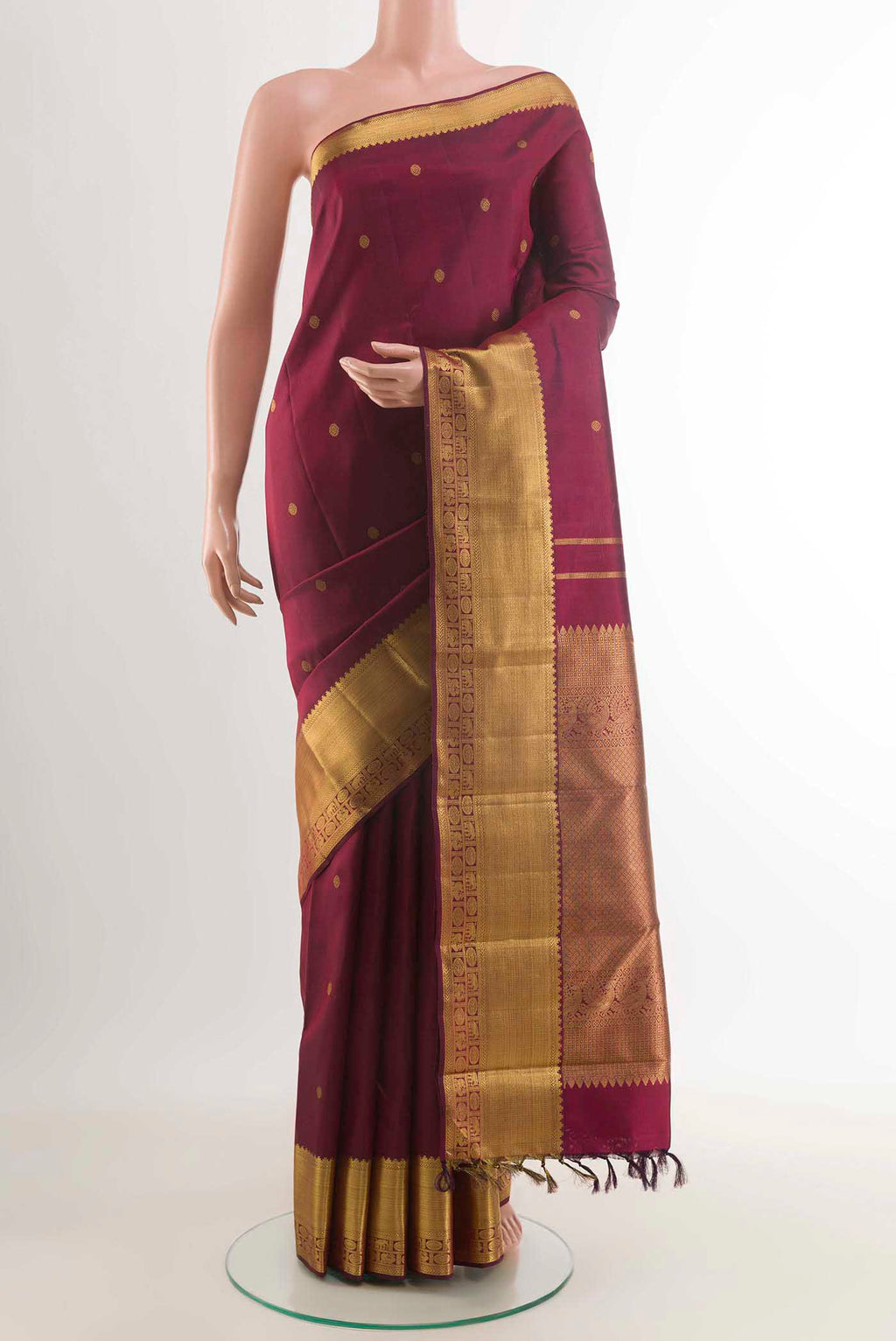 Pure Silk Pure Zari Maroon Dual Tone Kanchipuram Saree with Zari Butta on the body and Zari Border displayed on a mannequin