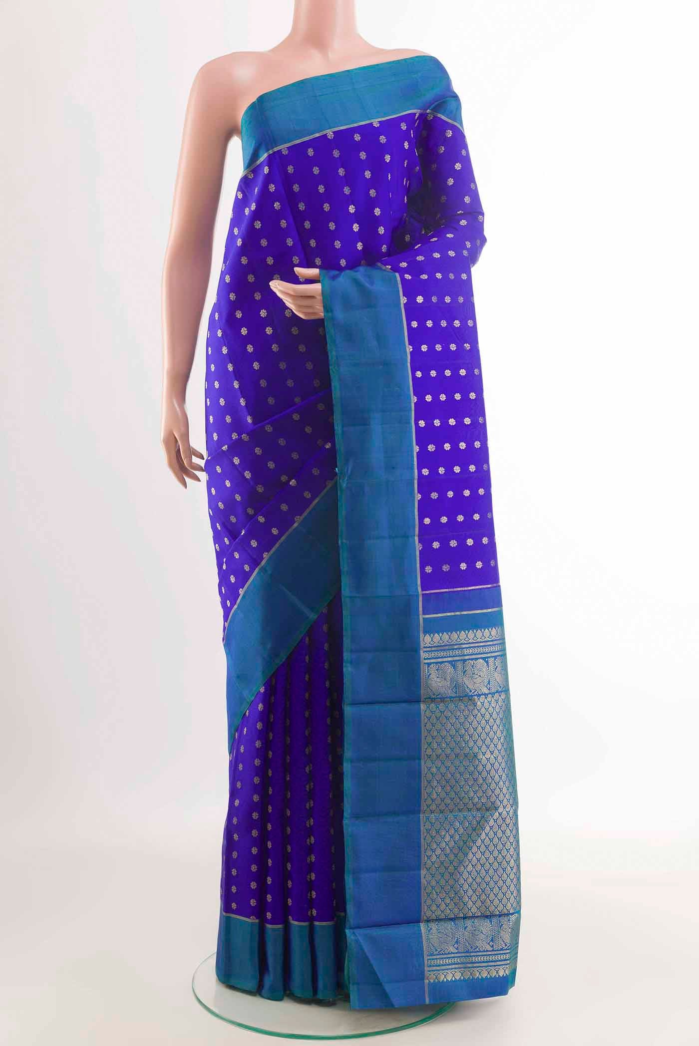 Blue Kanchipuram Silk Saree with Zari Butta on the body and Zari Border displayed on a mannequin