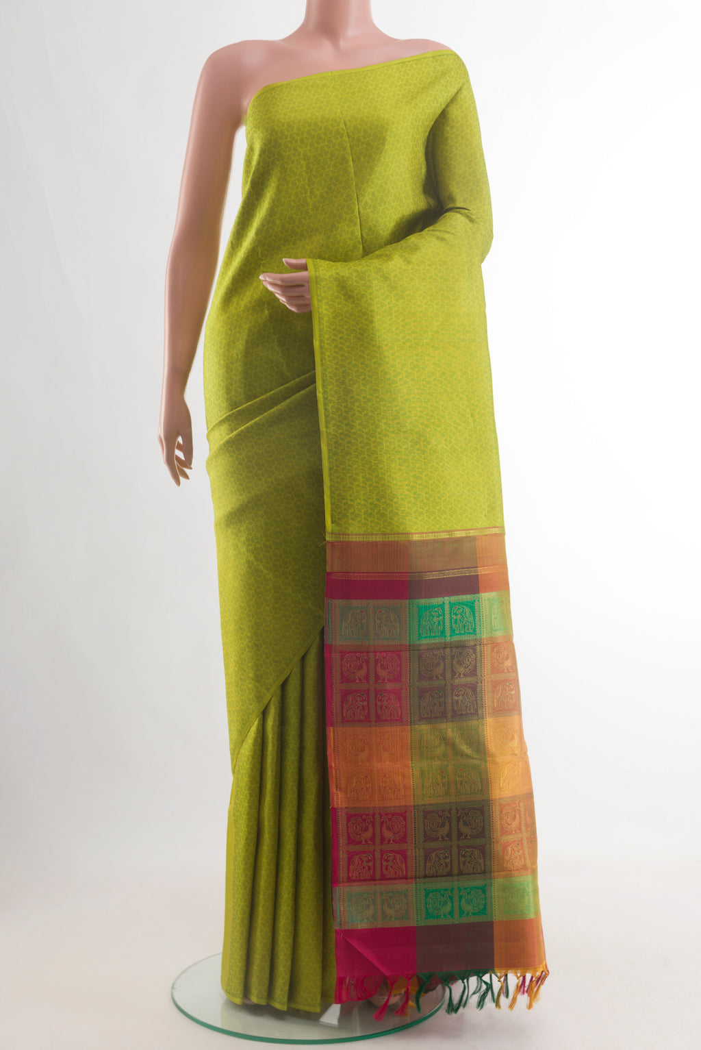 Green Kanjivaram Silk Saree with Jacquard design on the body and Without Border.  displayed on a mannequin
