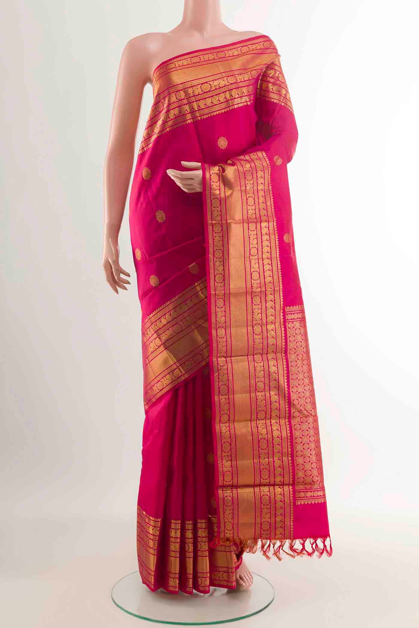 Pure Silk Pure Zari Pink Dual Tone Kanchipuram Saree with Zari Butta on the body and Zari Border displayed on a mannequin