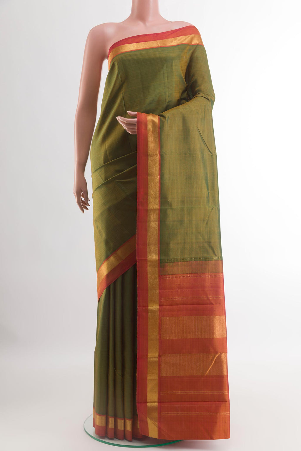 Green Kanjivaram Silk Saree with Plain Body and Zari Border.  displayed on a mannequin