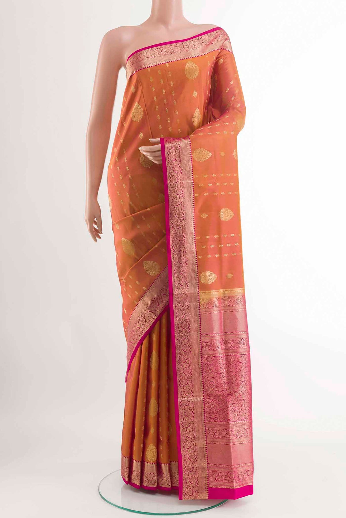 Peach Dual Tone Soft Silk Saree with Zari Butta on the body and Zari Border displayed on a mannequin