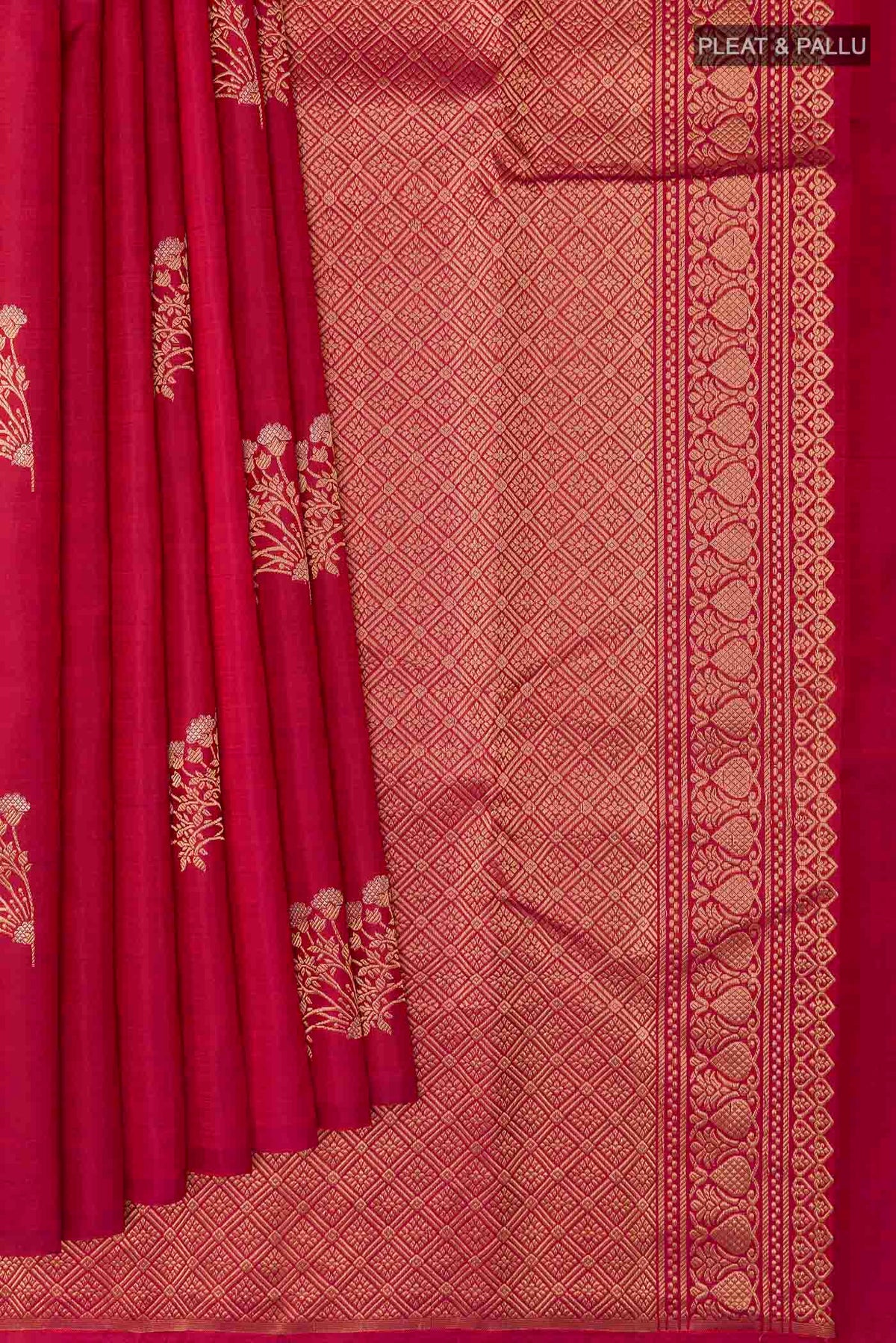 Pleats and pallu of Maroon Kanchipuram Silk Saree with Zari Butta on the body and Zari Border