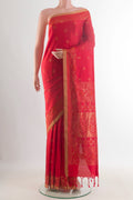 Pure Silk Red Soft Saree with Zari Butta on the body and Zari Border.  displayed on a mannequin