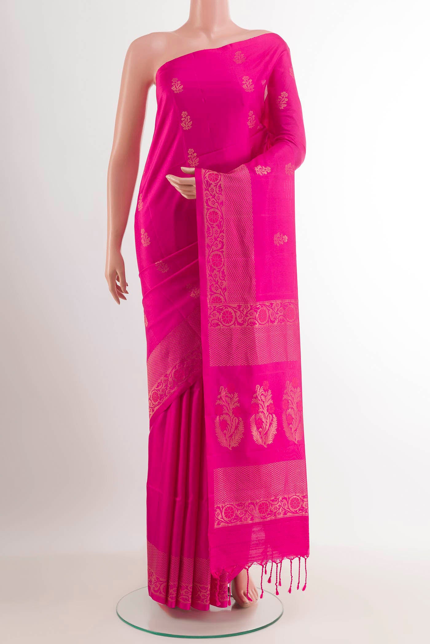 Pink Soft Silk Saree with Zari Butta on the body and Zari Border.  displayed on a mannequin