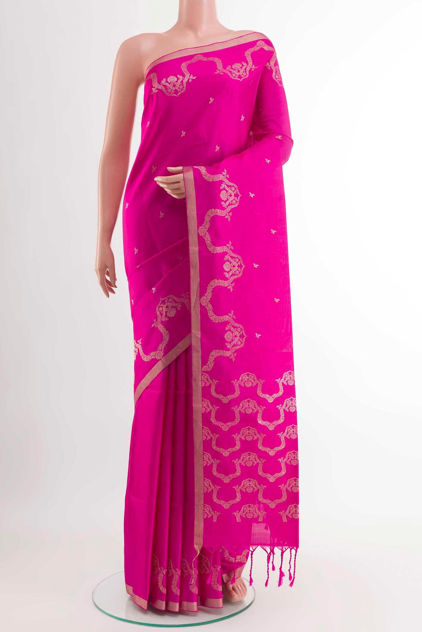Pink Soft Silk Saree with Zari Butta on the body and Zari Border displayed on a mannequin