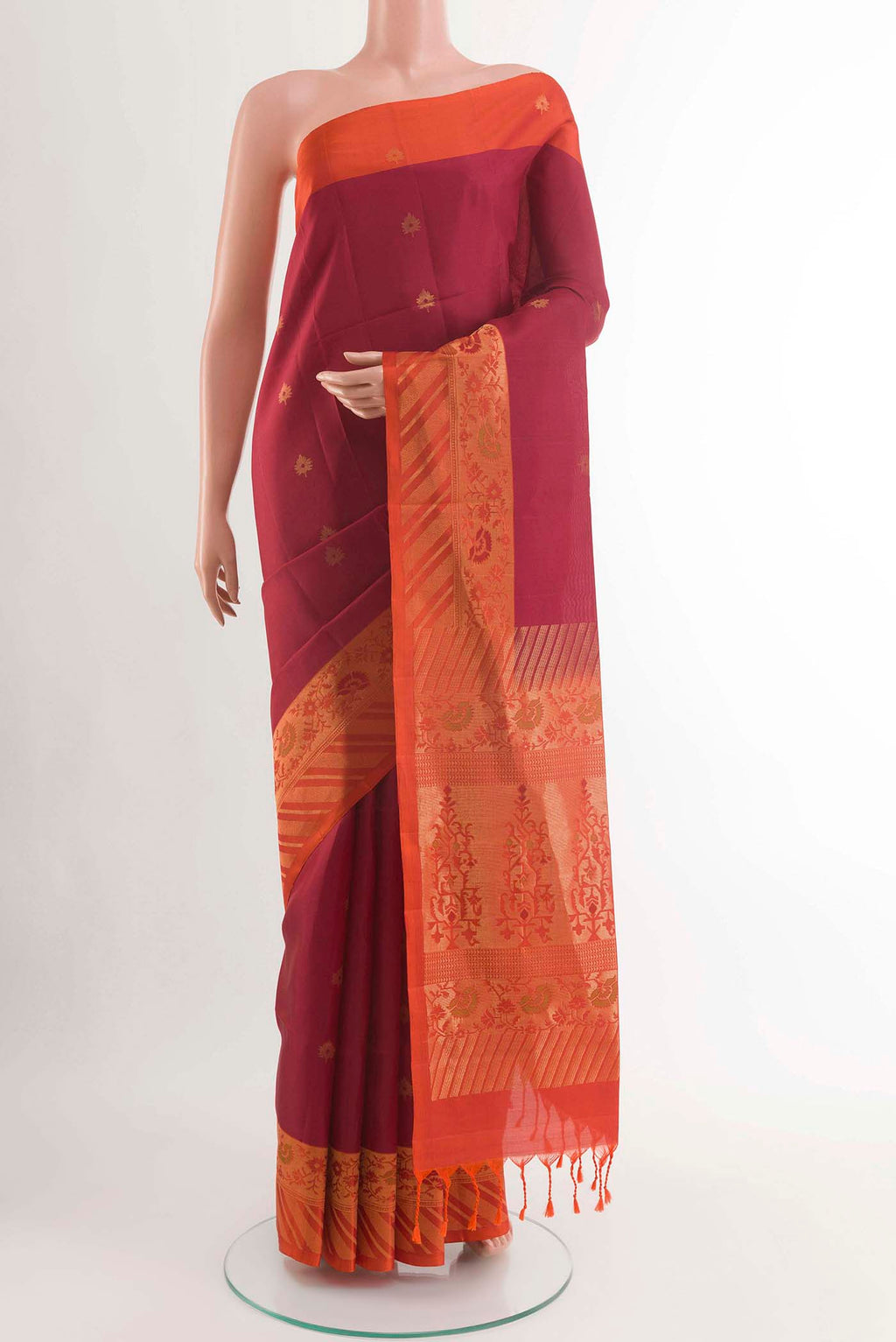 Maroon Soft Silk Saree with Zari Butta on the body and Zari Border displayed on a mannequin