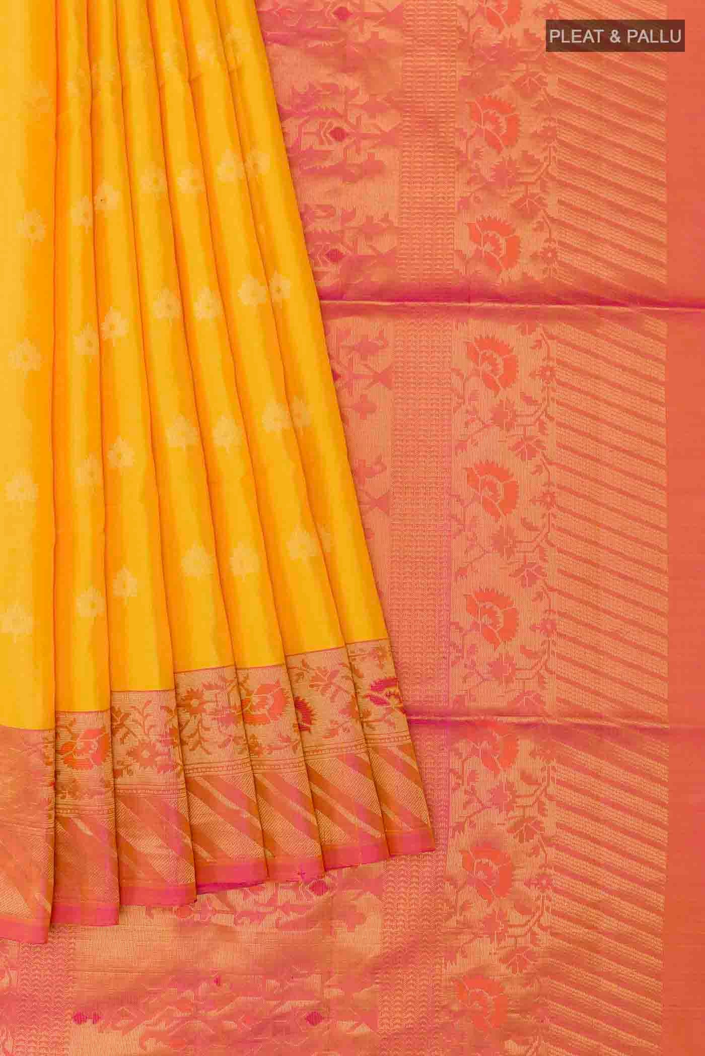 Pleats and pallu of Yellow Soft Silk Saree with Zari Butta on the body and Zari Border