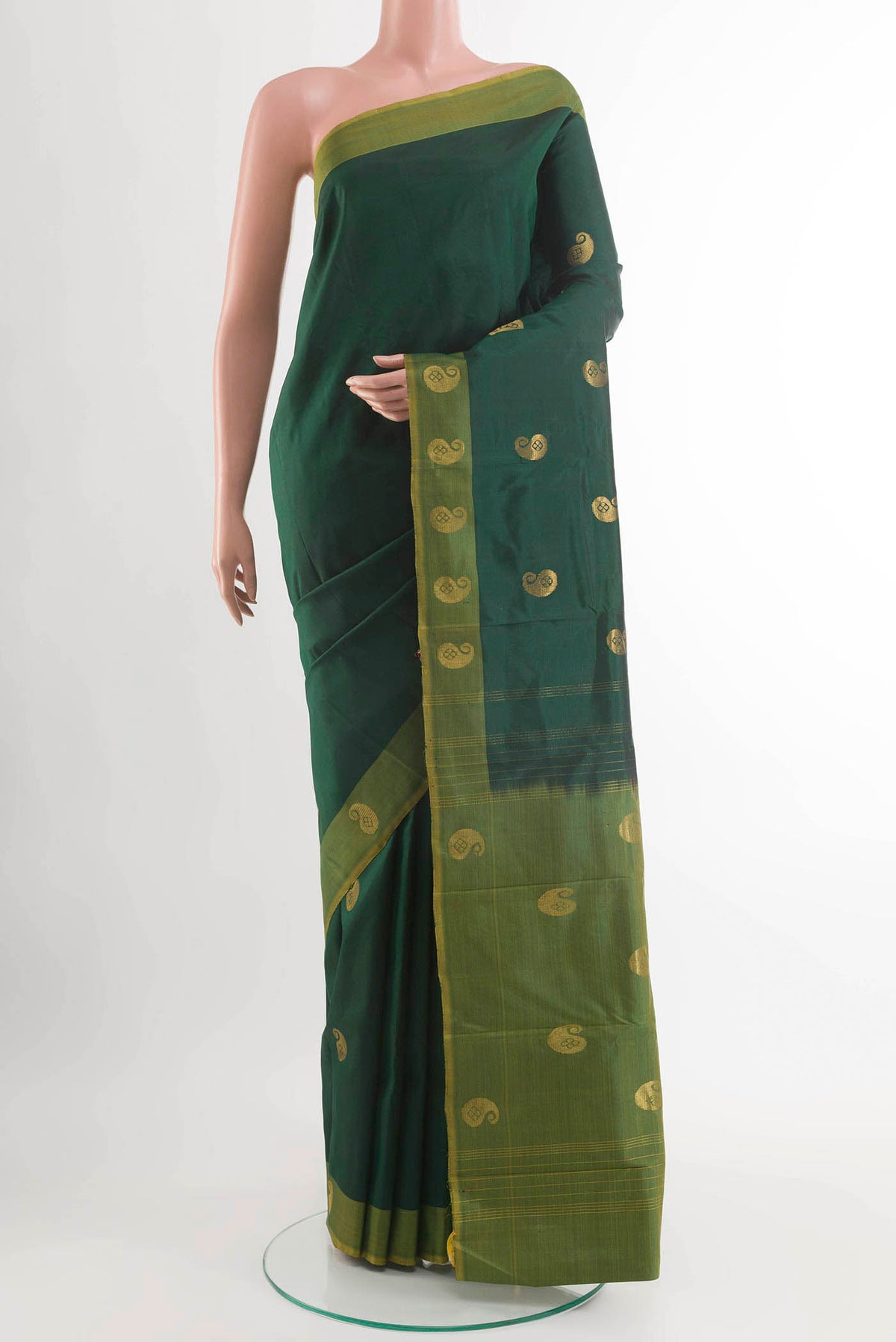 Bottle Green Kanchipuram Silk Saree with Zari Butta on the body and Zari Border displayed on a mannequin