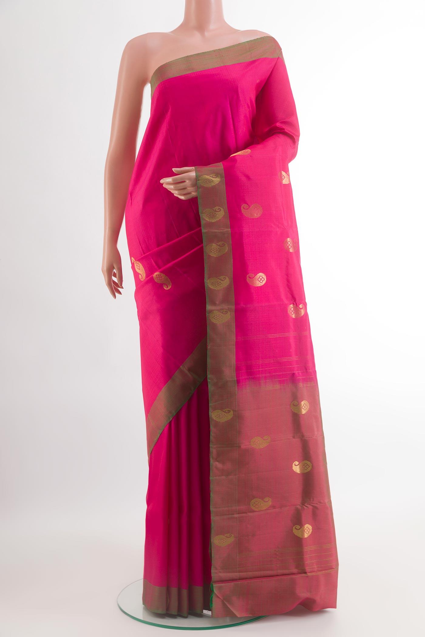 Pink Kanchipuram Silk Saree with Zari Butta on the body and Fancy Border.  displayed on a mannequin