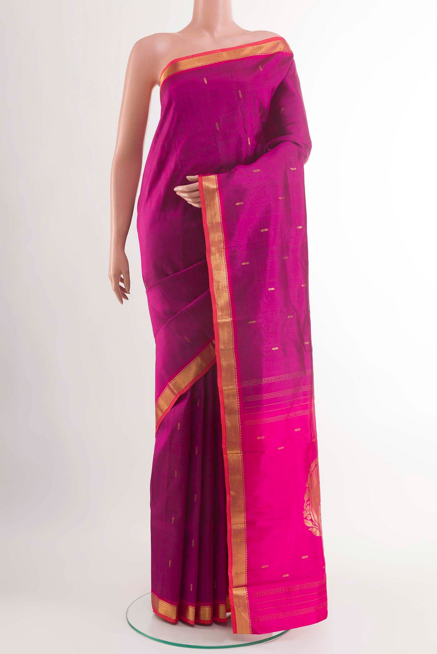 Purple Kanchipuram Silk Saree with Zari Butta on the body and Zari Border displayed on a mannequin