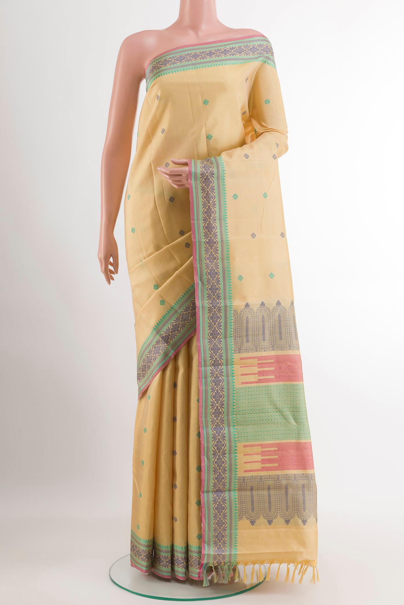 Lemon Yellow Kanchipuram Silk Saree with Jacquard design on the body and Thread Embroidery Border.  displayed on a mannequin