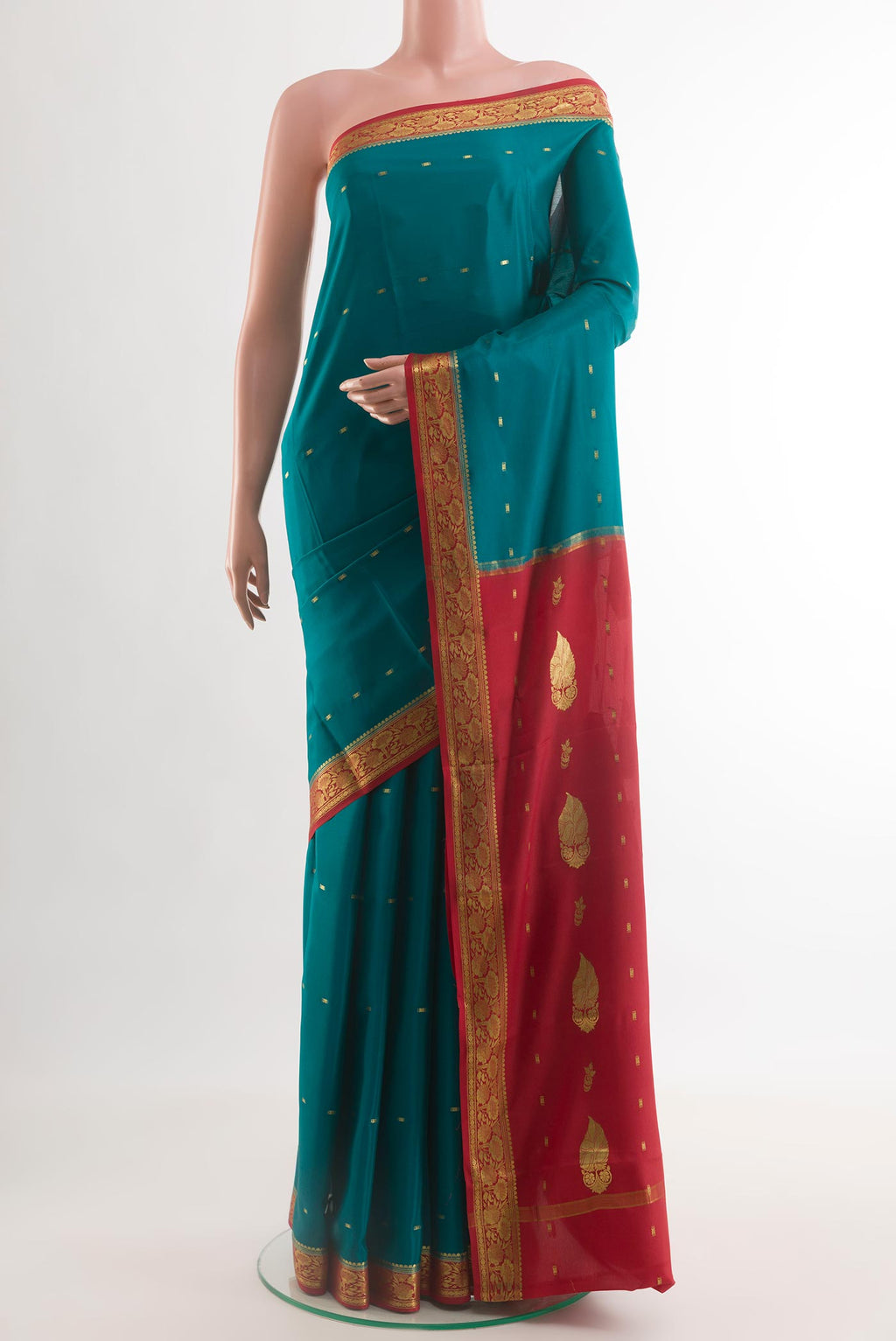 Teal Mysore Crepe Saree with Zari Butta on the body and Zari Border.  displayed on a mannequin