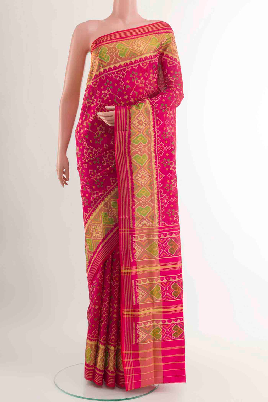 Pink Rajkot Patola Silk Saree with Ikat design on the body and Zari Border displayed on a mannequin