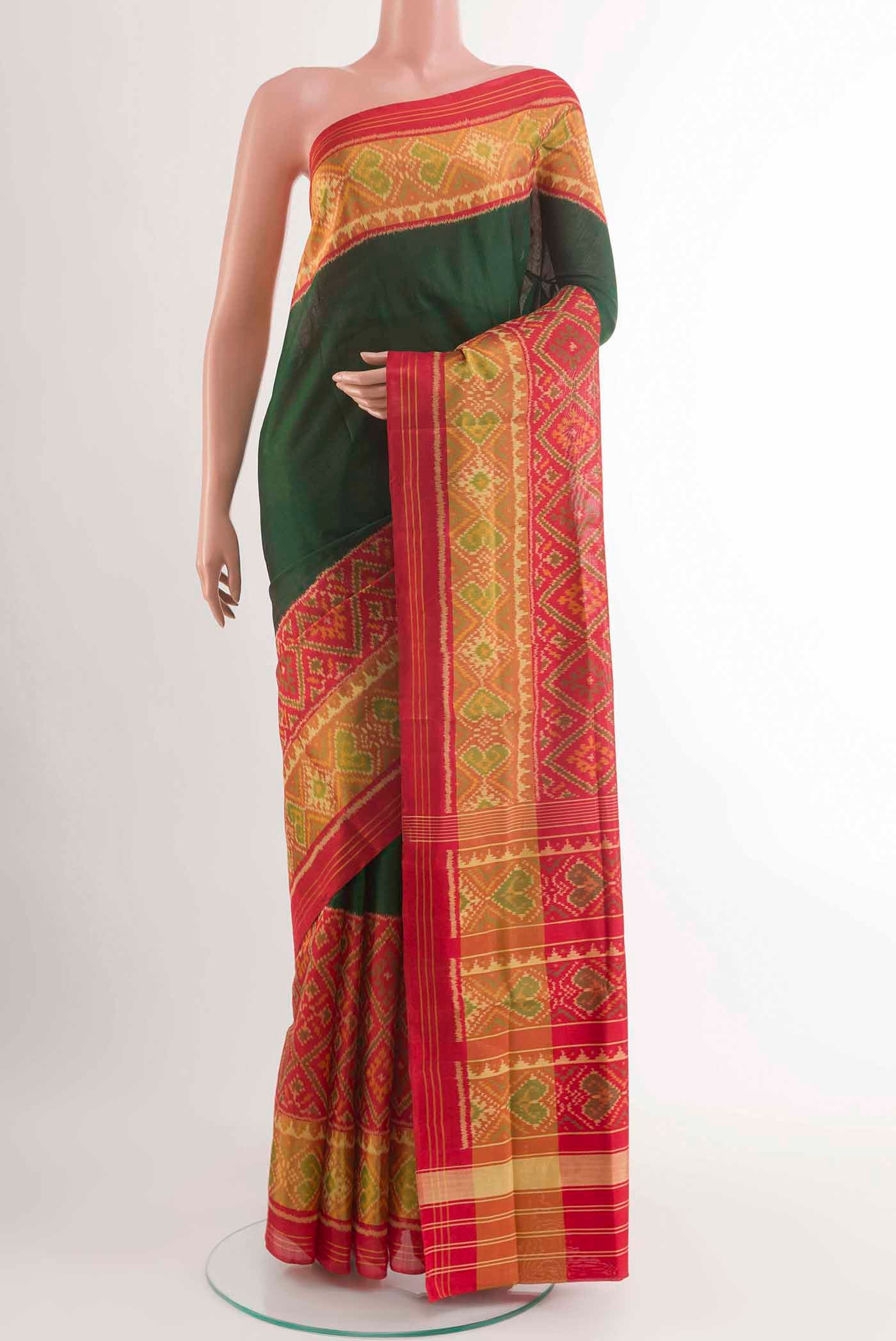 Green Rajkot Patola Silk Saree with Plain Body and Zari Border displayed on a mannequin