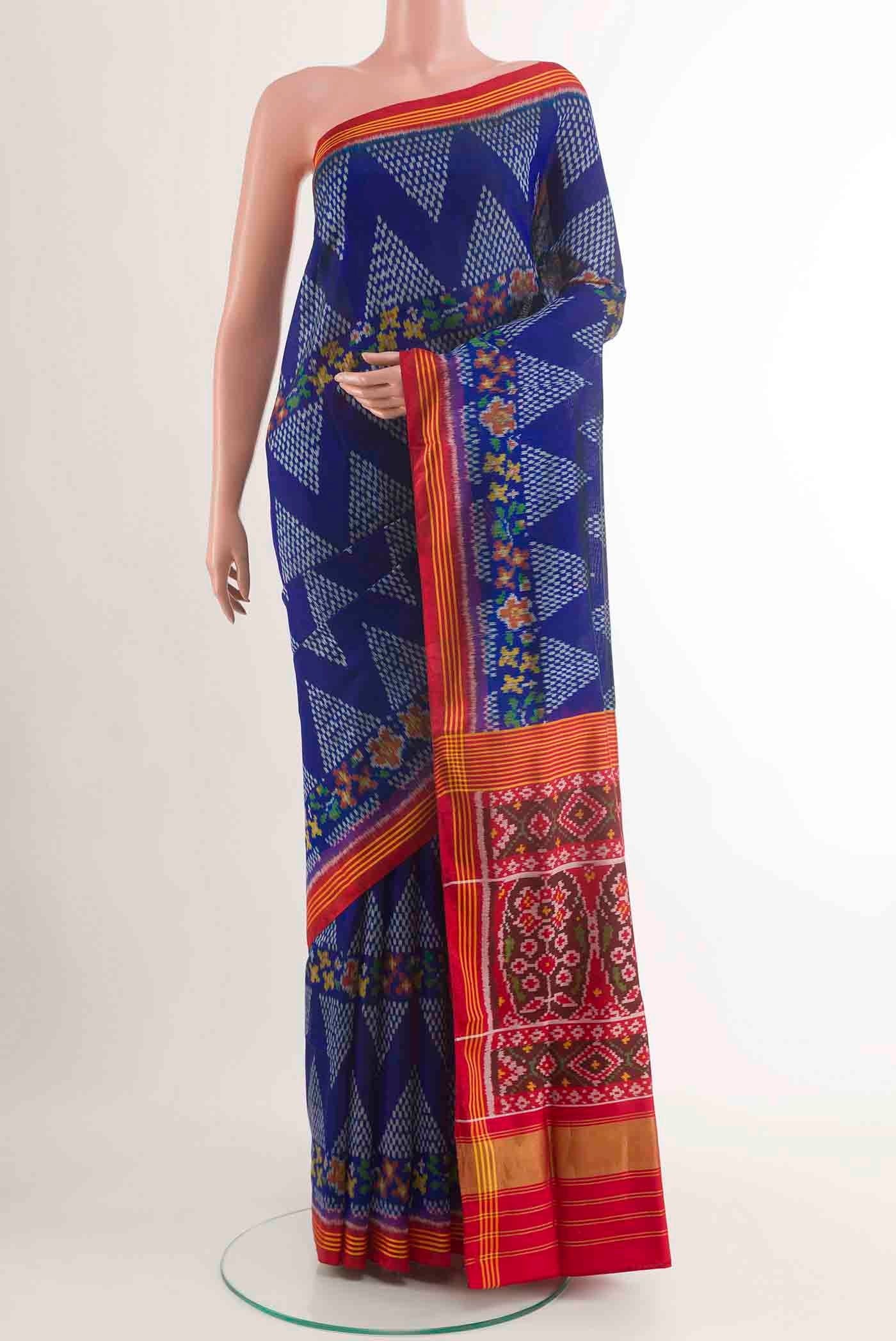 Blue Rajkot Patola Silk Saree with Pure Ikat on the body and Zari Border displayed on a mannequin