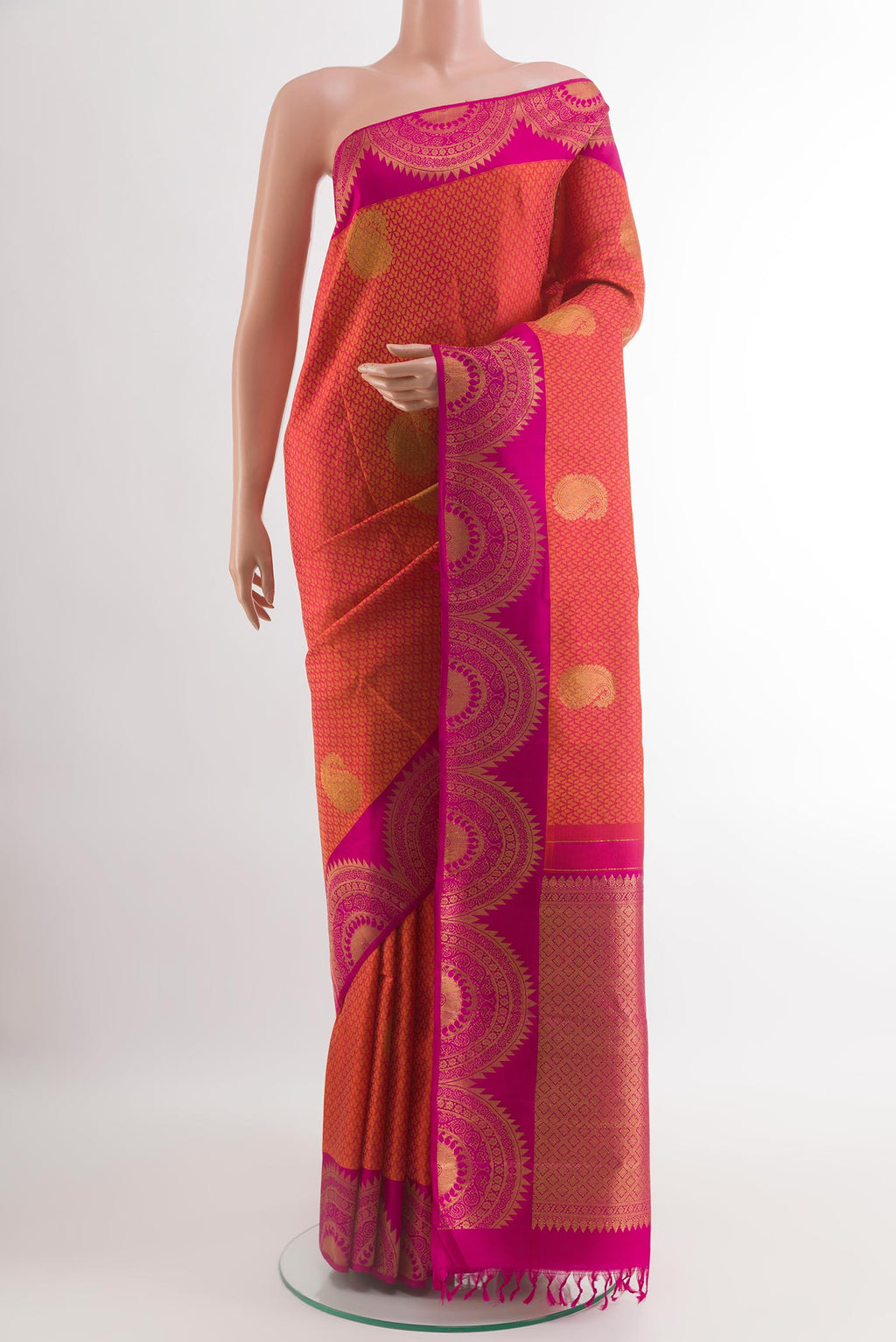 Brick Orange Kanchipuram Silk Saree with Jacquard With Zari Butta on the body and Fancy Border.  displayed on a mannequin