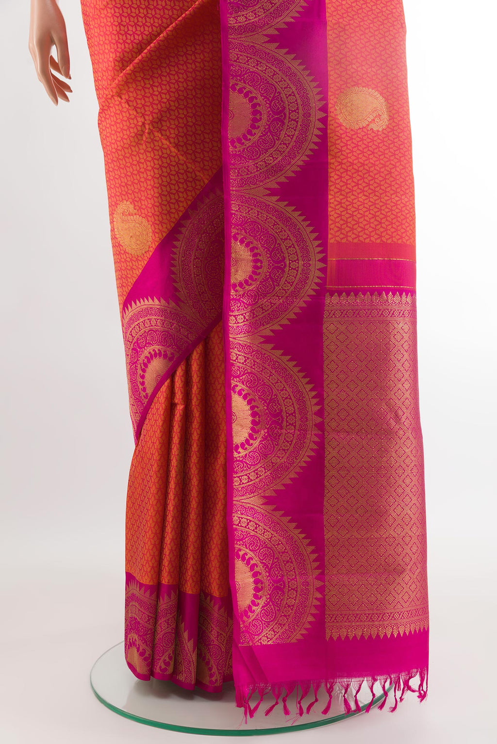 Pleats and pallu of Brick Orange Kanchipuram Silk Saree with Jacquard With Zari Butta on the body and Fancy Border. 