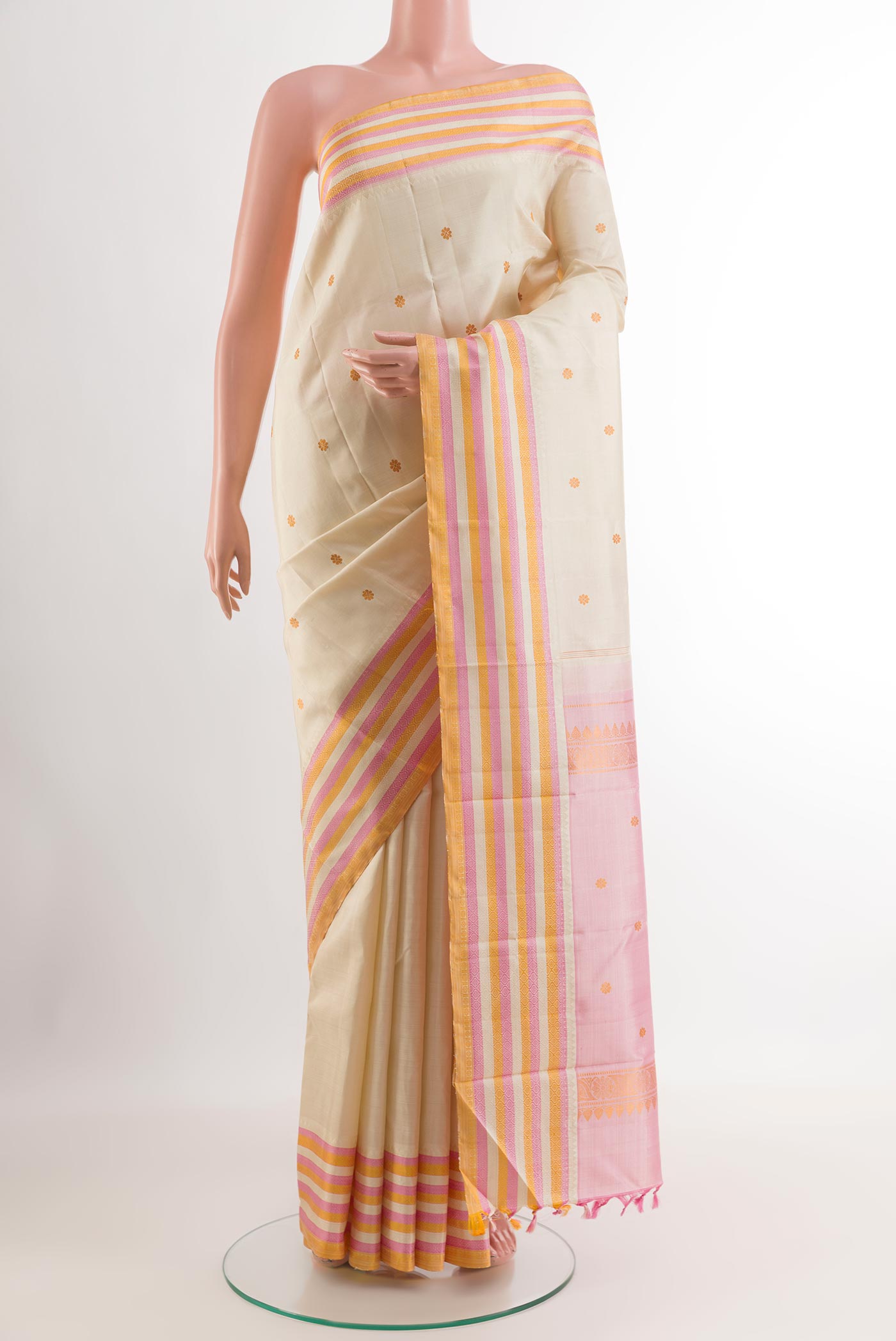 White Kanjivaram Silk Saree with Thread Butta on the body and Without Border.  displayed on a mannequin