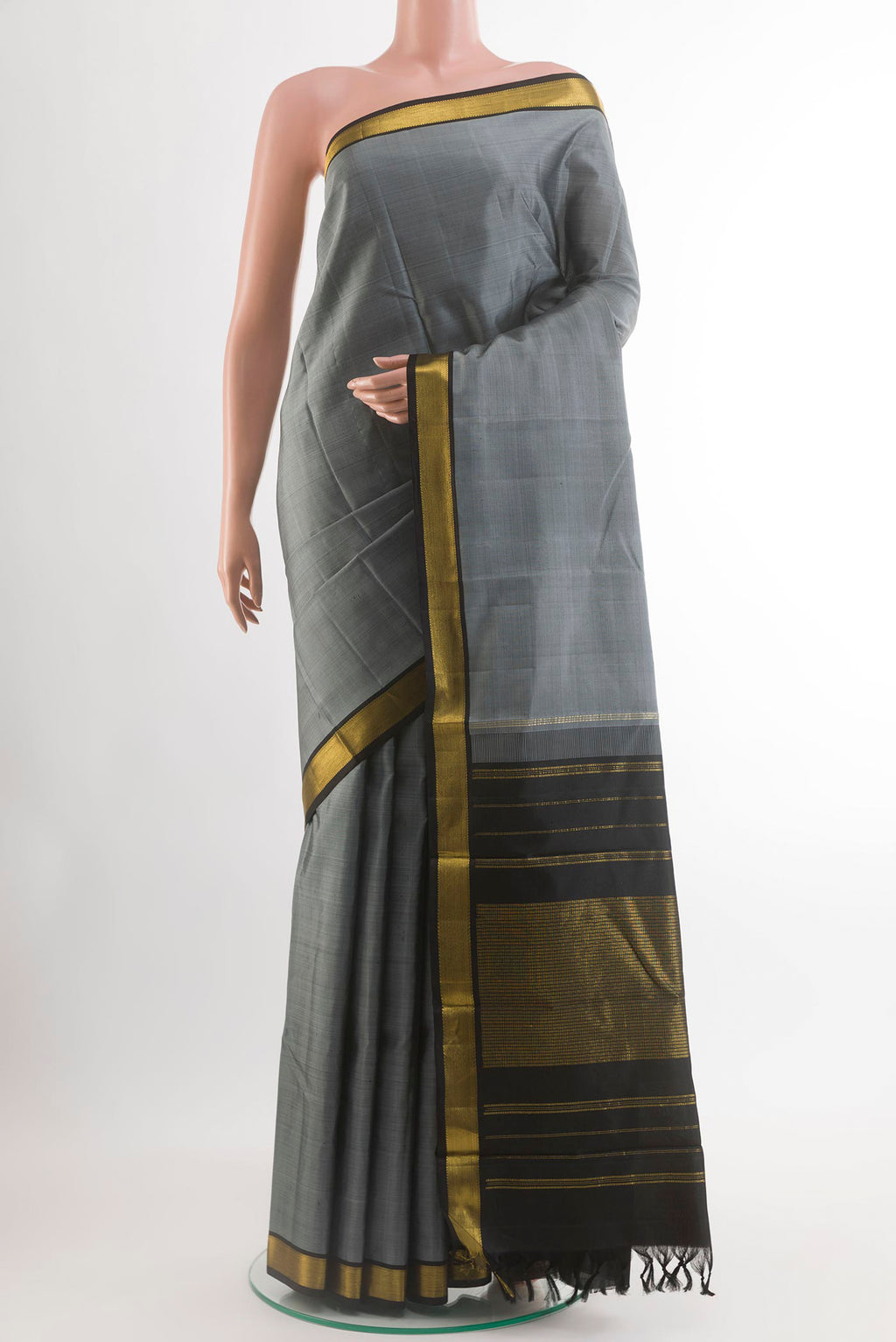 Grey Kanjivaram Silk Saree with Plain Body and Zari Border.  displayed on a mannequin