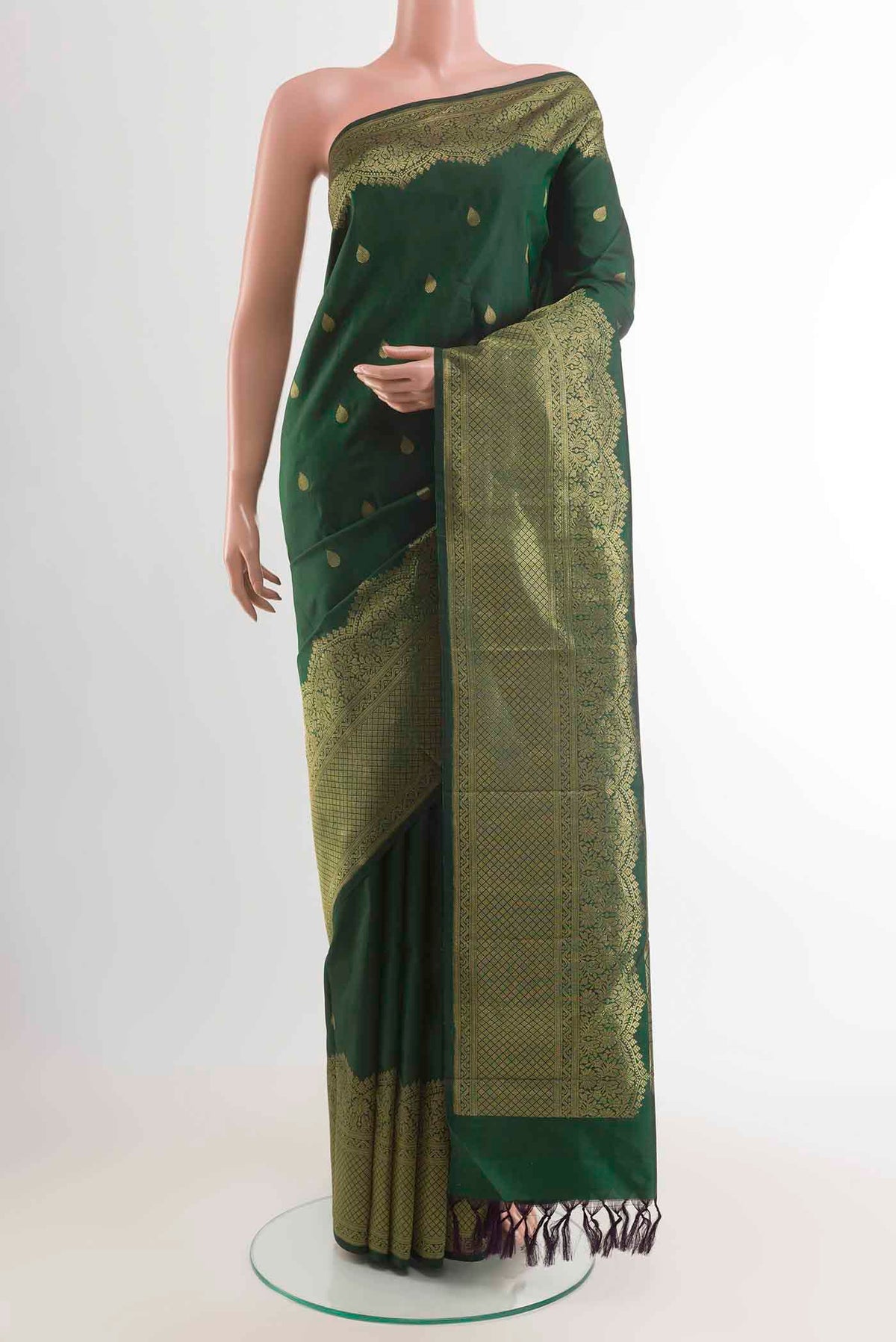 Bottle Green Kanchipuram Silk Saree with Zari Brocade on the body and Zari Border displayed on a mannequin
