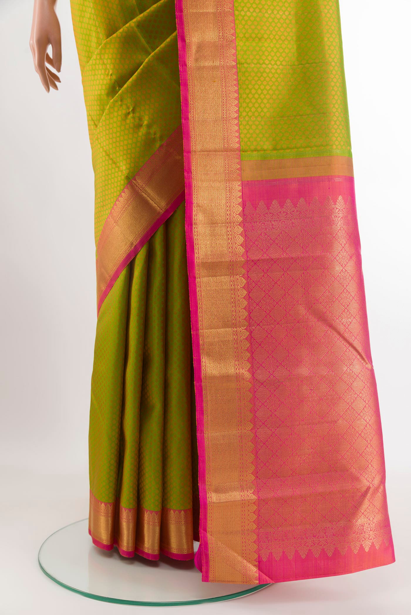 Pleats and pallu of Green Kanchipuram Silk Saree with Jacquard design on the body and Zari Border. 