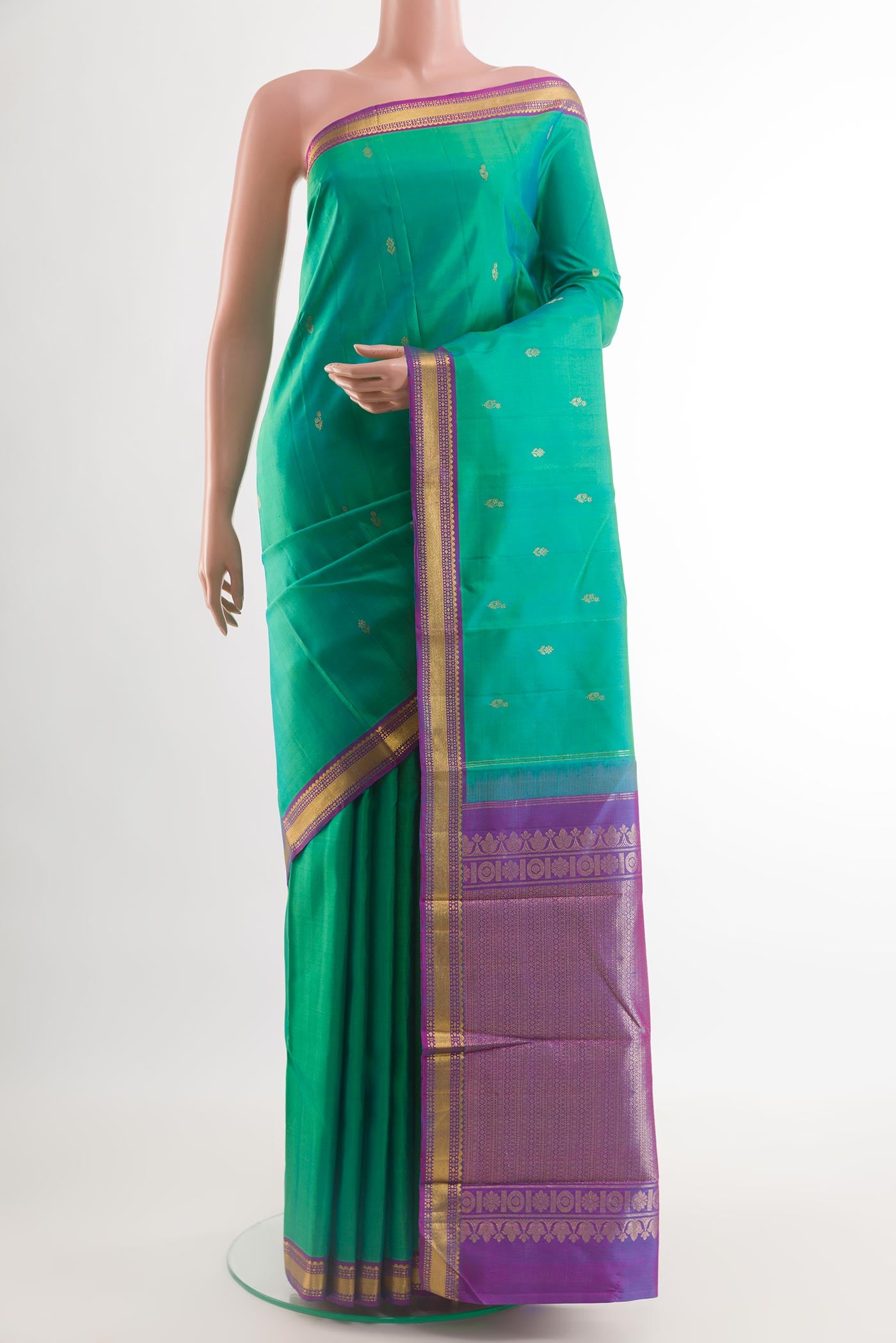 Sea Green Kanchipuram Silk Saree with Zari Butta on the body and Zari Border.  displayed on a mannequin