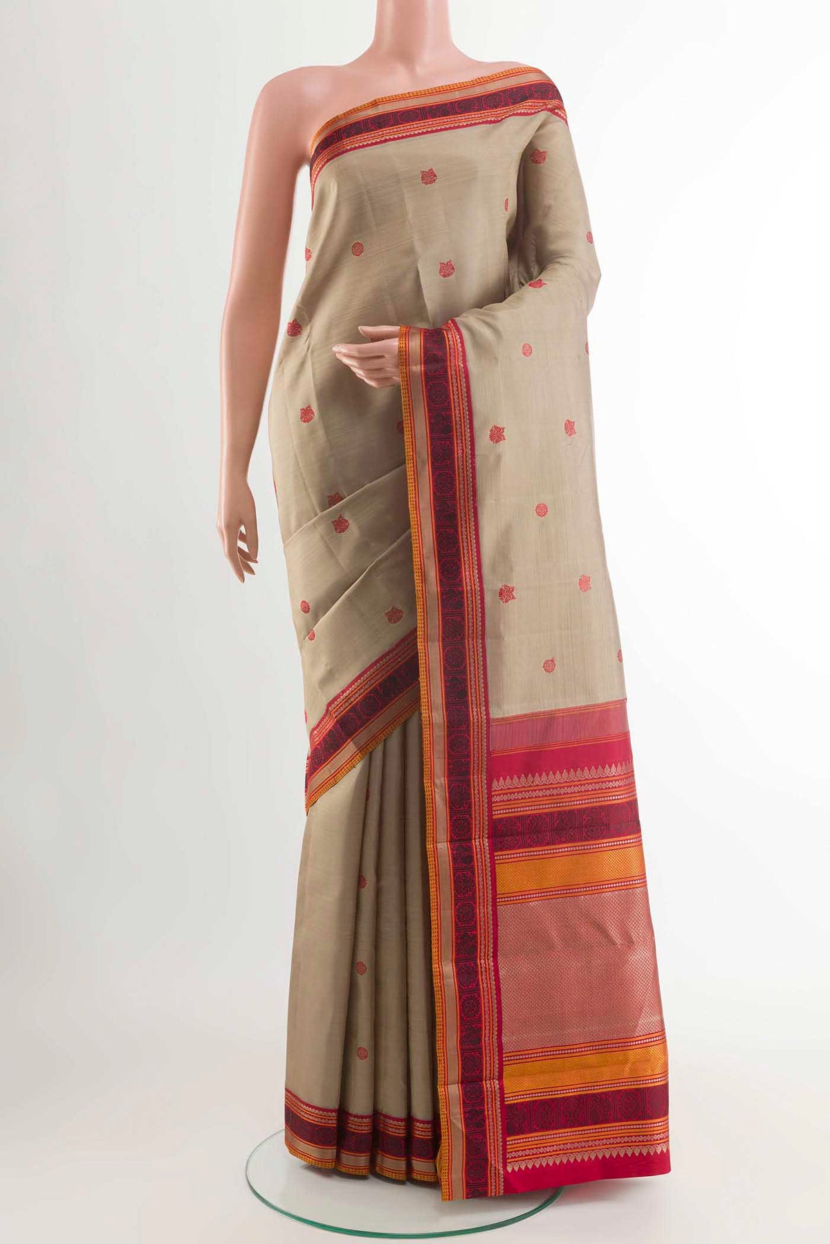 Beige Kanchipuram Silk Saree with Thread Butta on the body and Thread Border displayed on a mannequin