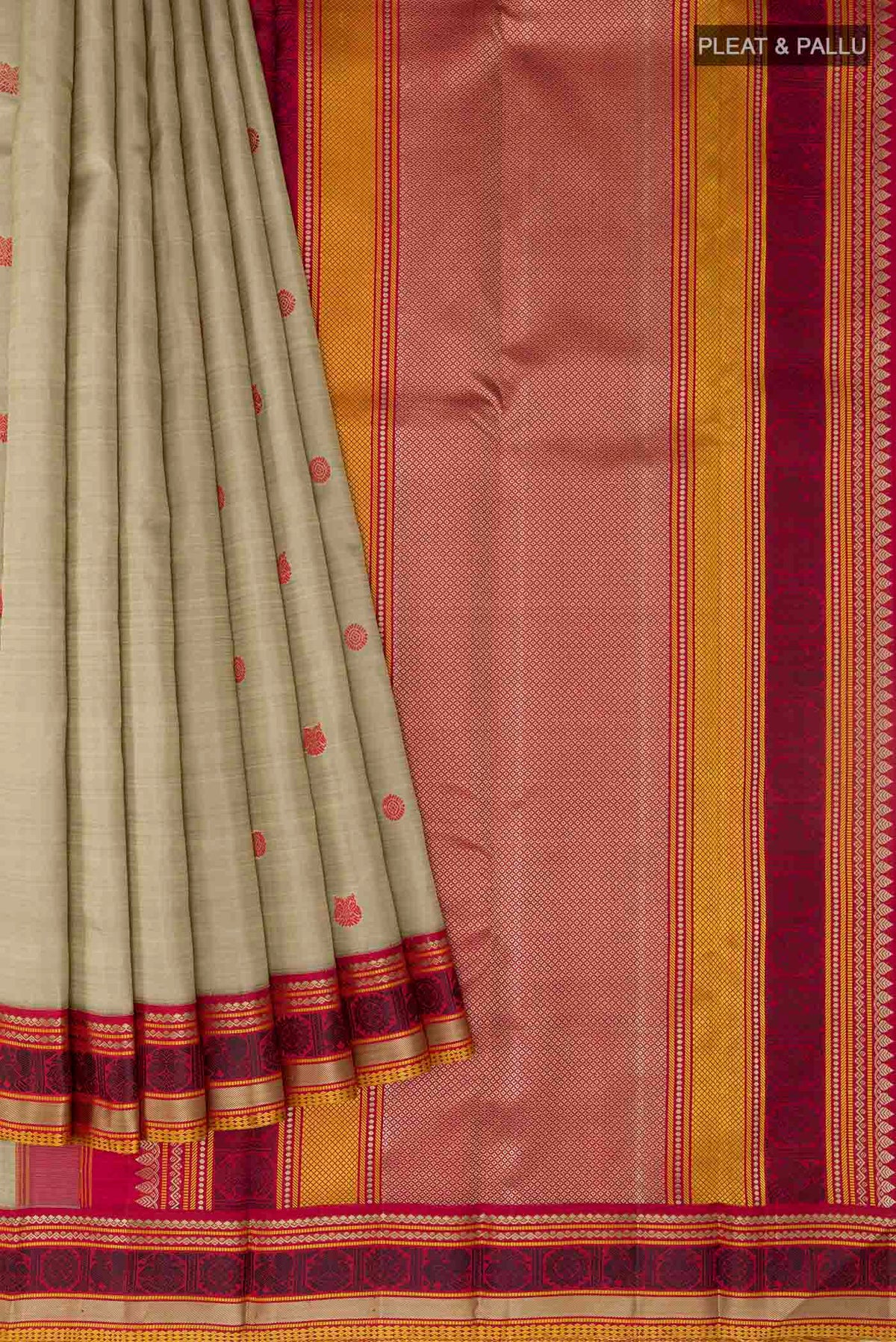 Pleats and pallu of Beige Kanchipuram Silk Saree with Thread Butta on the body and Thread Border