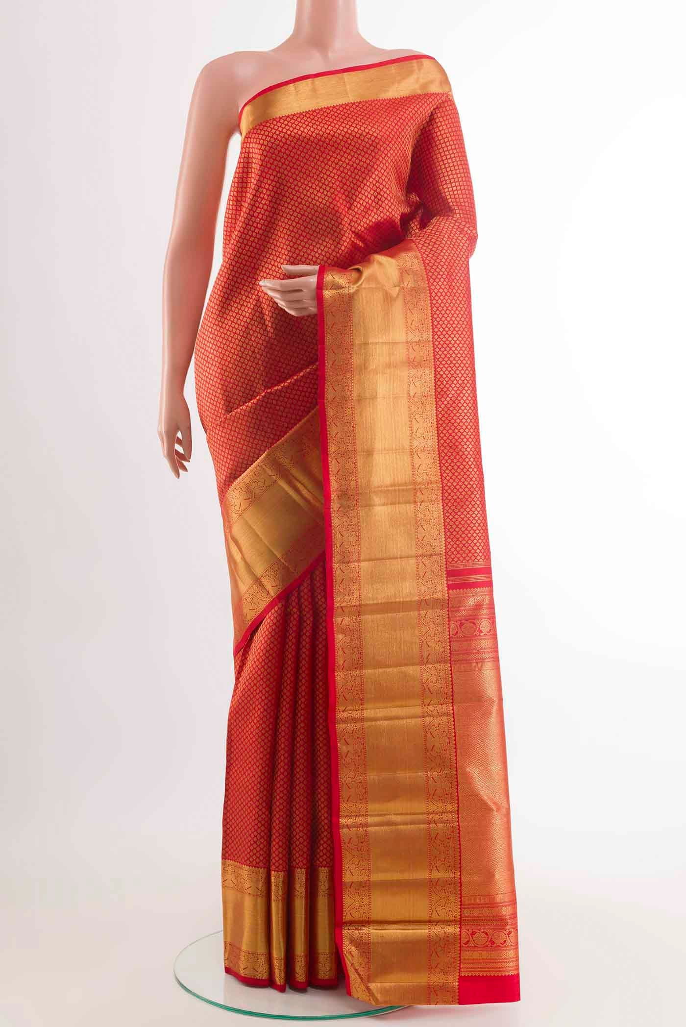 Pure Silk Pure Zari Red Kanchipuram Saree with Zari Butta on the body and Zari Border displayed on a mannequin
