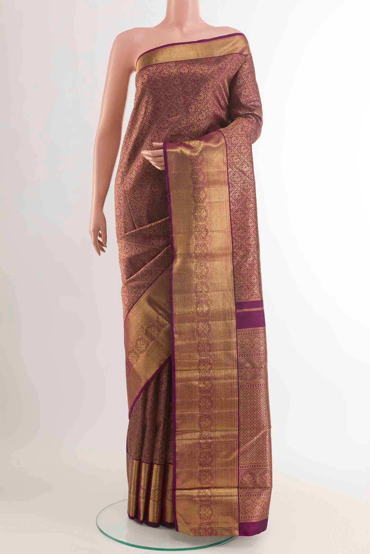 Pure Silk Pure Zari Purple Kanchipuram Saree with Zari Brocade on the body and Zari Border displayed on a mannequin