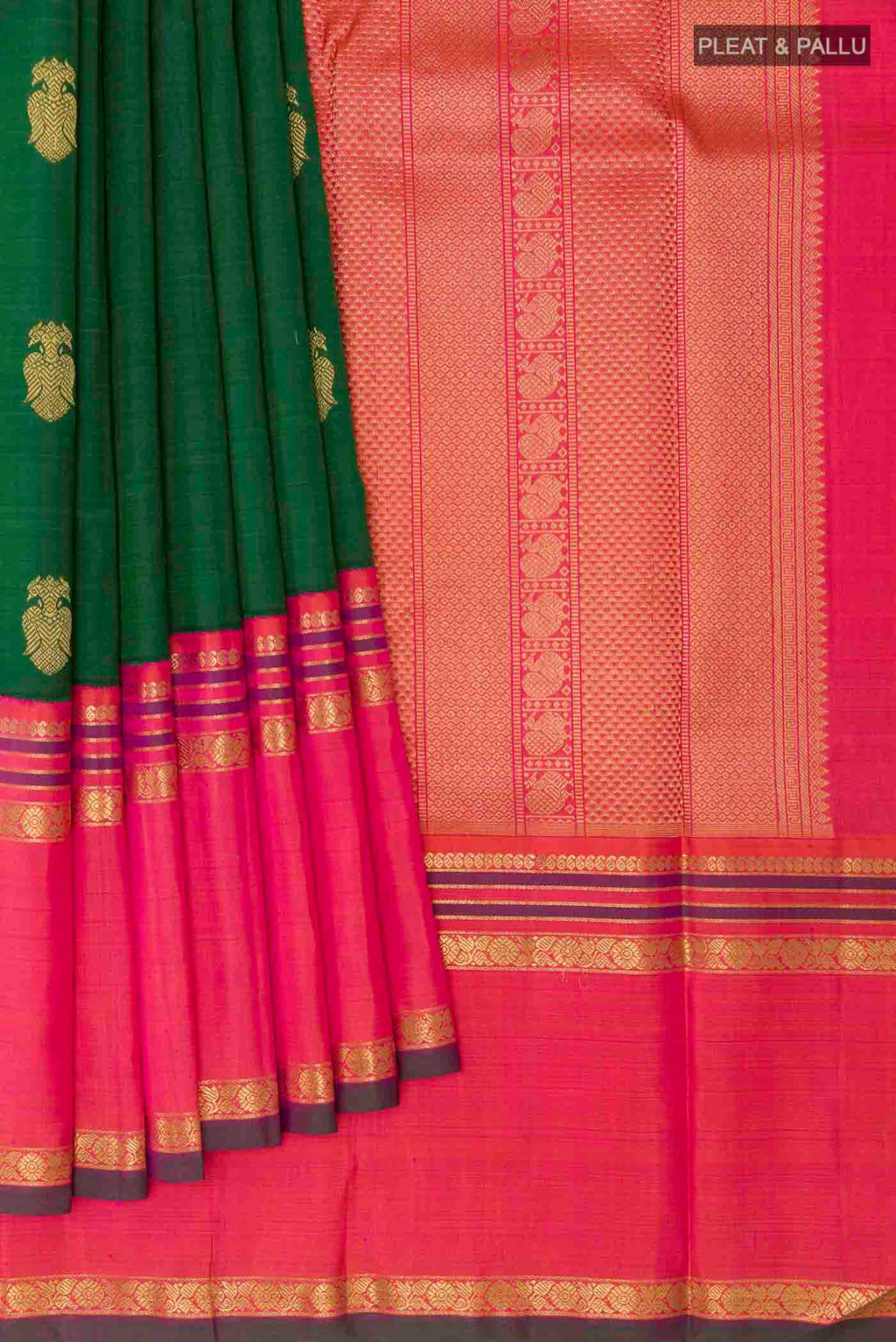 Pleats and pallu of Green Kanchipuram Silk Saree with Zari Butta on the body and Zari Border