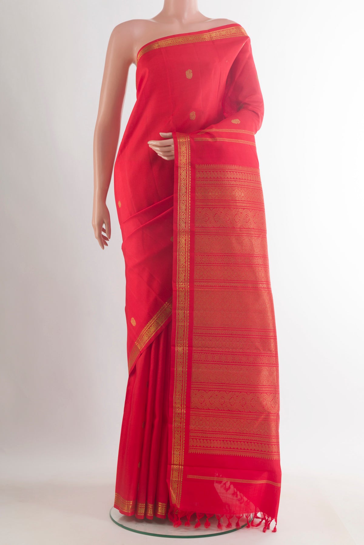 Pure Silk Pure Zari Red Kanchipuram Saree with Zari Brocade on the body and Zari Border.  displayed on a mannequin