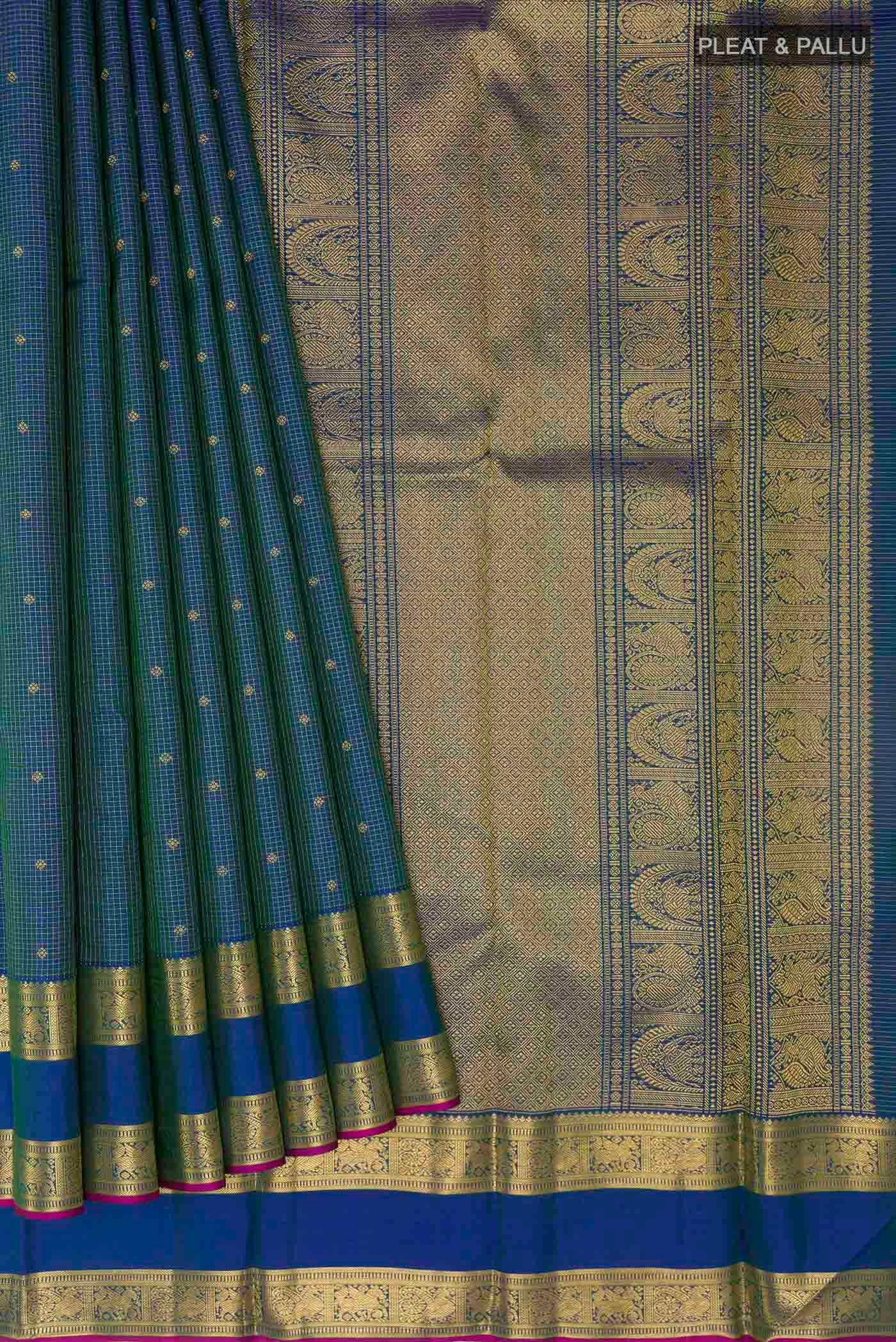 Pleats and pallu of Pure Silk Pure Zari Peacock Blue Kanchipuram Saree with Zari Butta on the body and Zari Border
