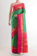 Green Kanchipuram Silk Saree with Plain Body and Zari Border displayed on a mannequin