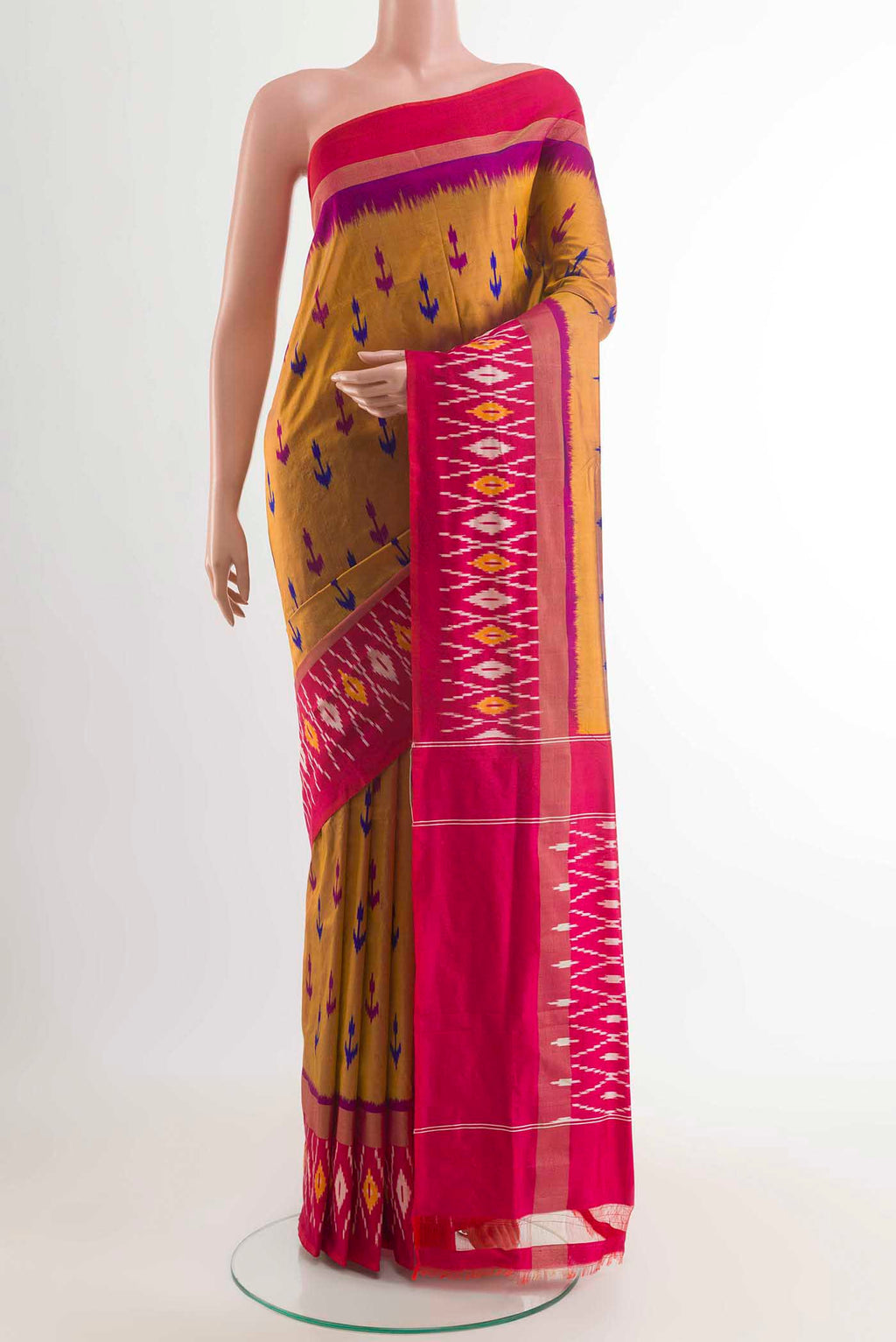 Mustard Pochampally Silk Saree with Pure Ikat on the body and Zari Border displayed on a mannequin