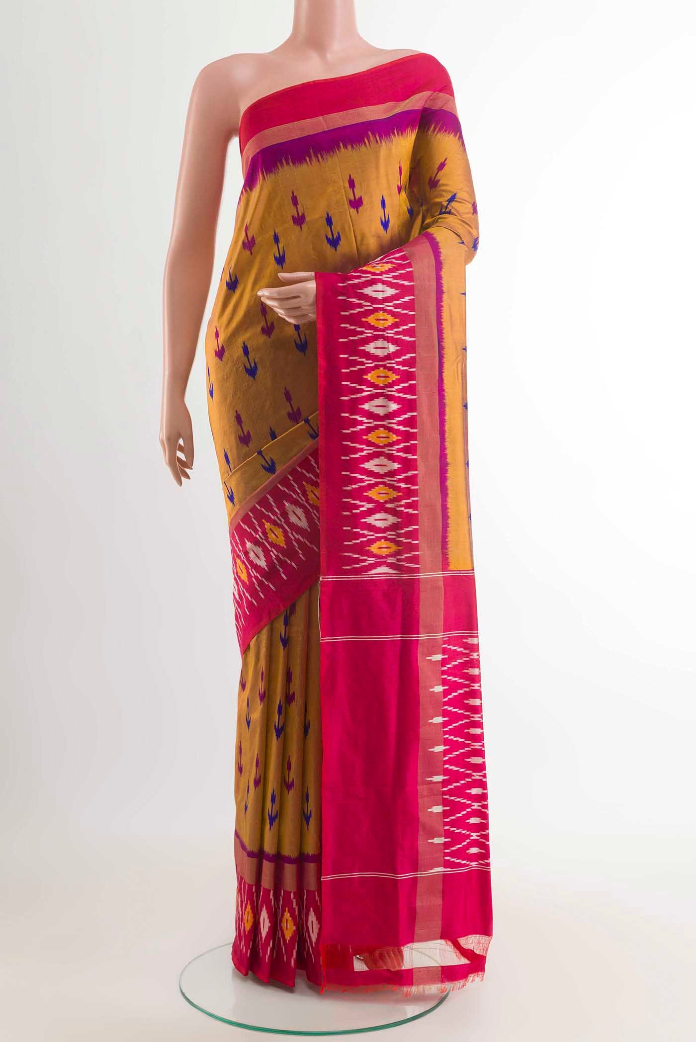 Mustard Pochampally Silk Saree with Pure Ikat on the body and Zari Border displayed on a mannequin