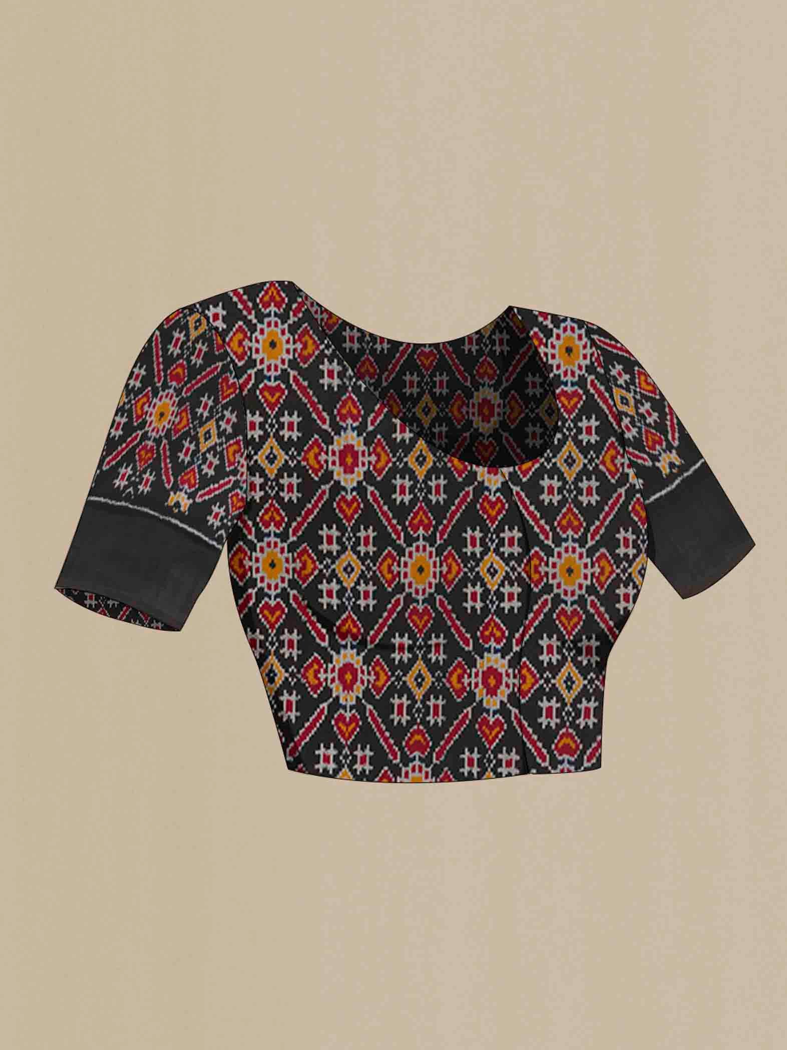 Close up image of the blouse of White Pochampally Silk Saree with Zari Butta on the body and Ikat Border