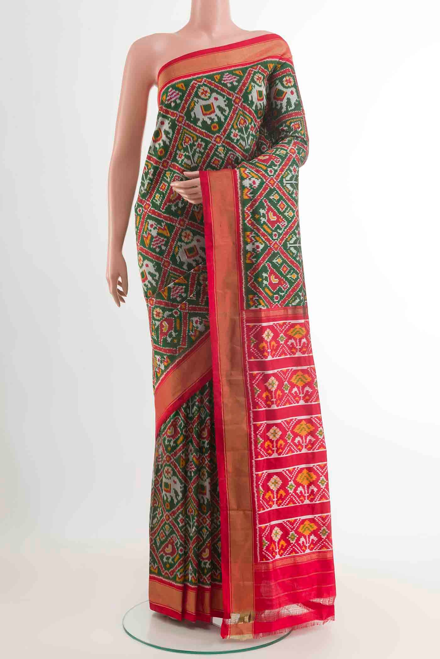 Green Dual Tone Pochampally Silk Saree with Pure Ikat on the body and Zari Border displayed on a mannequin
